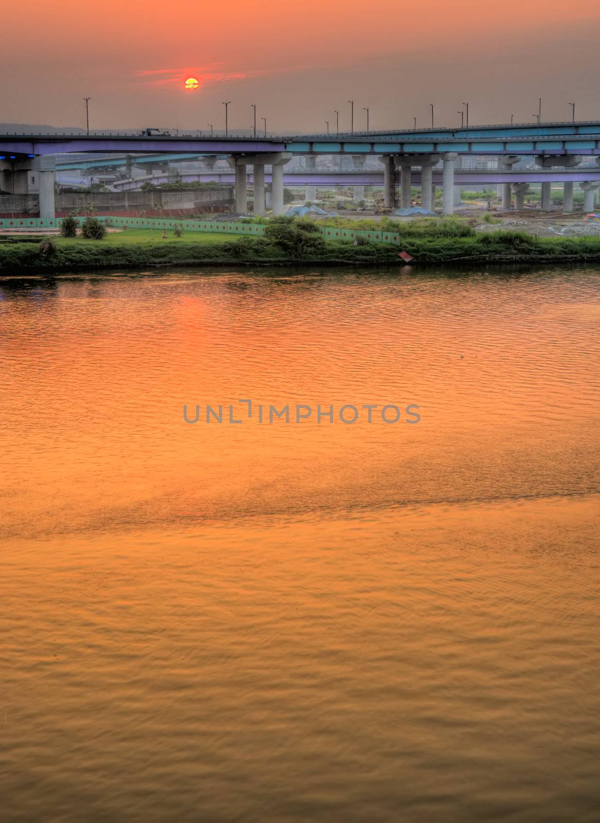 Here is city landscape of river sunset.
