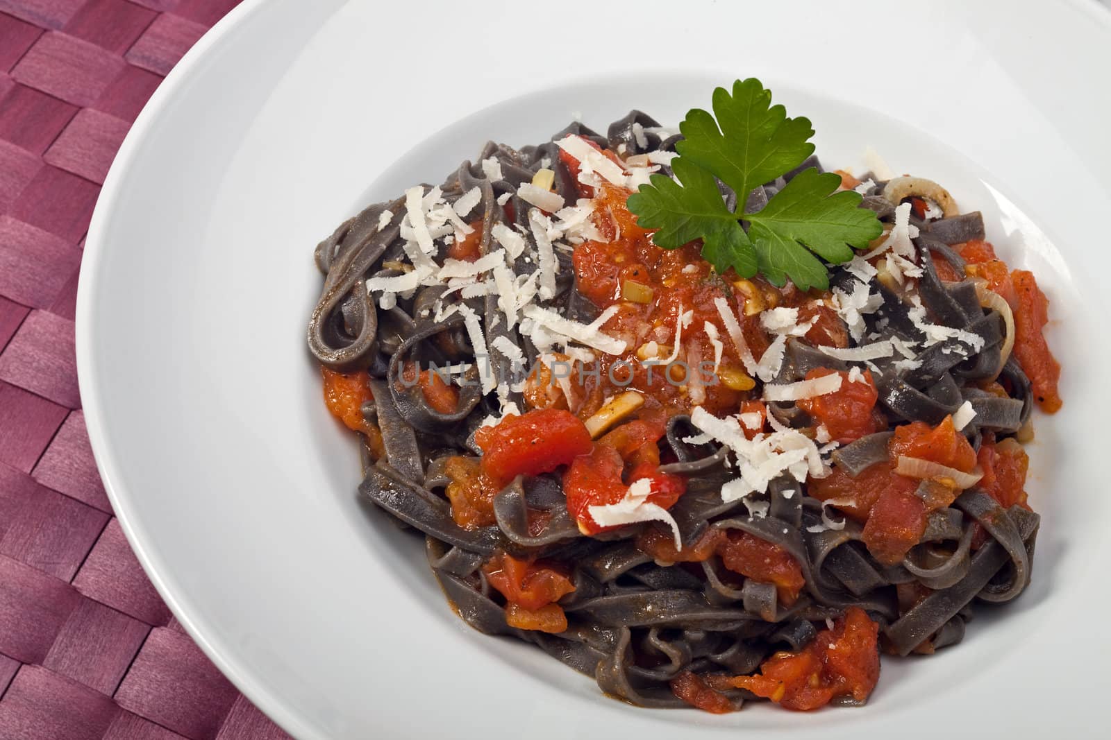 sepia colored tagliatelle with tomato sauce