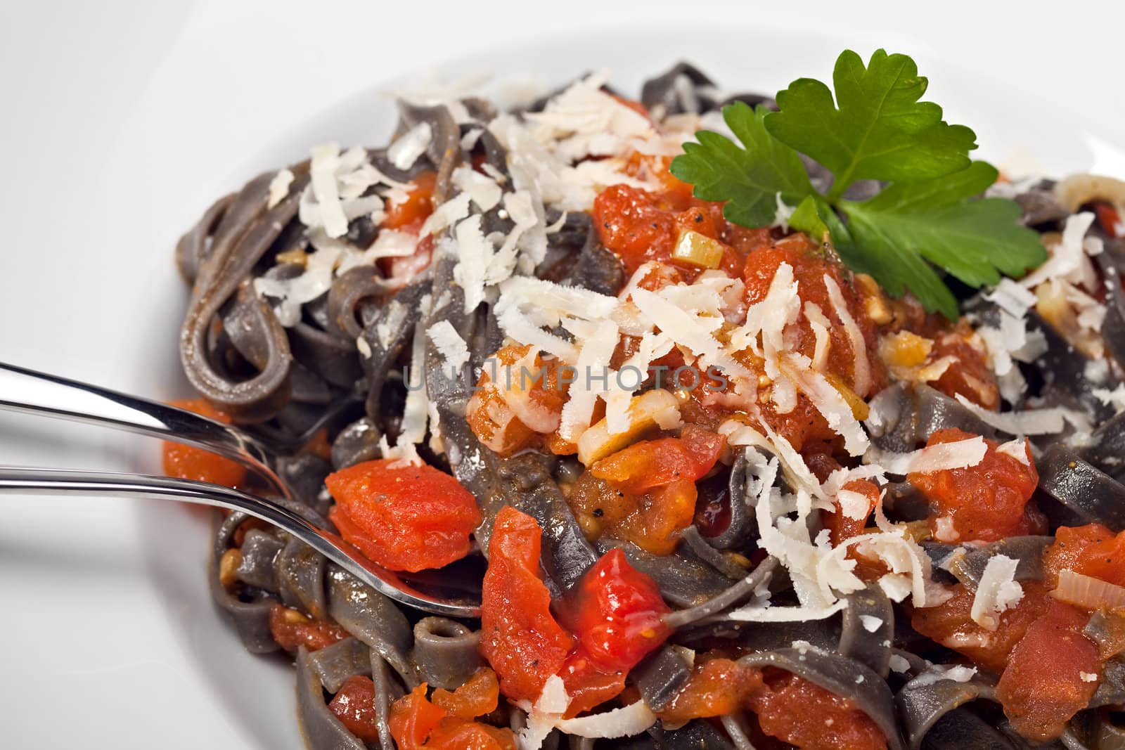 sepia colored tagliatelle with tomato sauce