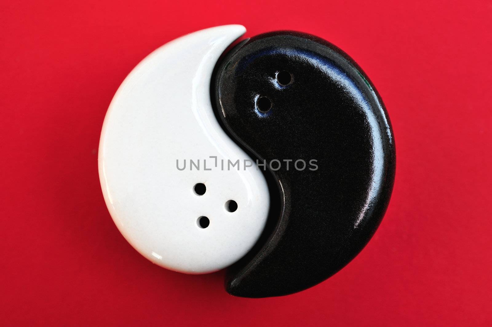 Graphic symbol of Ying and Yang, on a red background