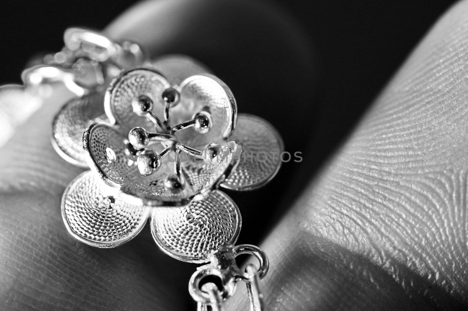 Silver lotus flower detail in a bracelet jewel