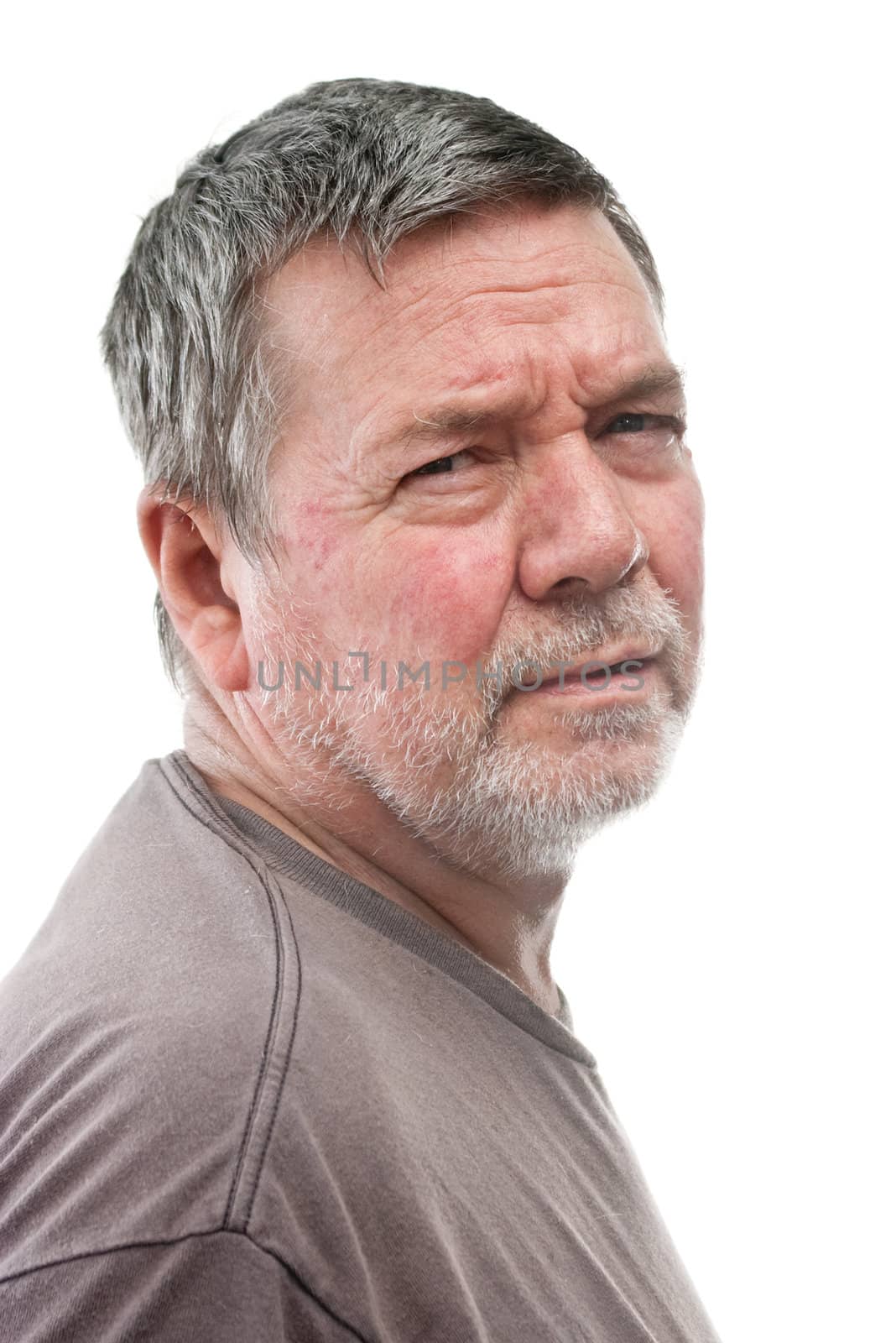 Mature man of 58 years, with white stubbly beard, 2/3 view head & shoulders, isolated on white
