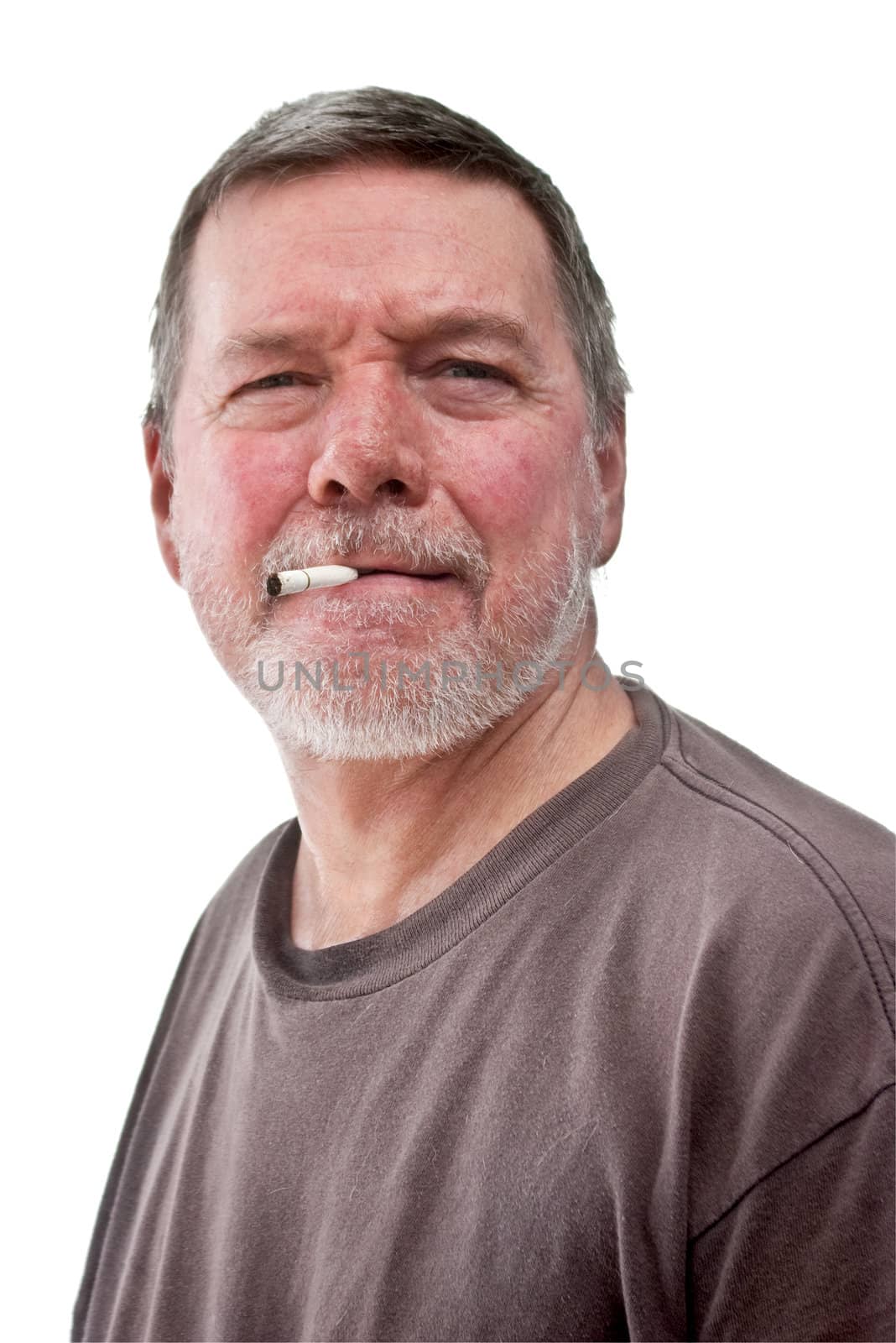 Headshot of mature homeless man with cigarette butt, scruffy beard and t-shirt.  Isolated on white