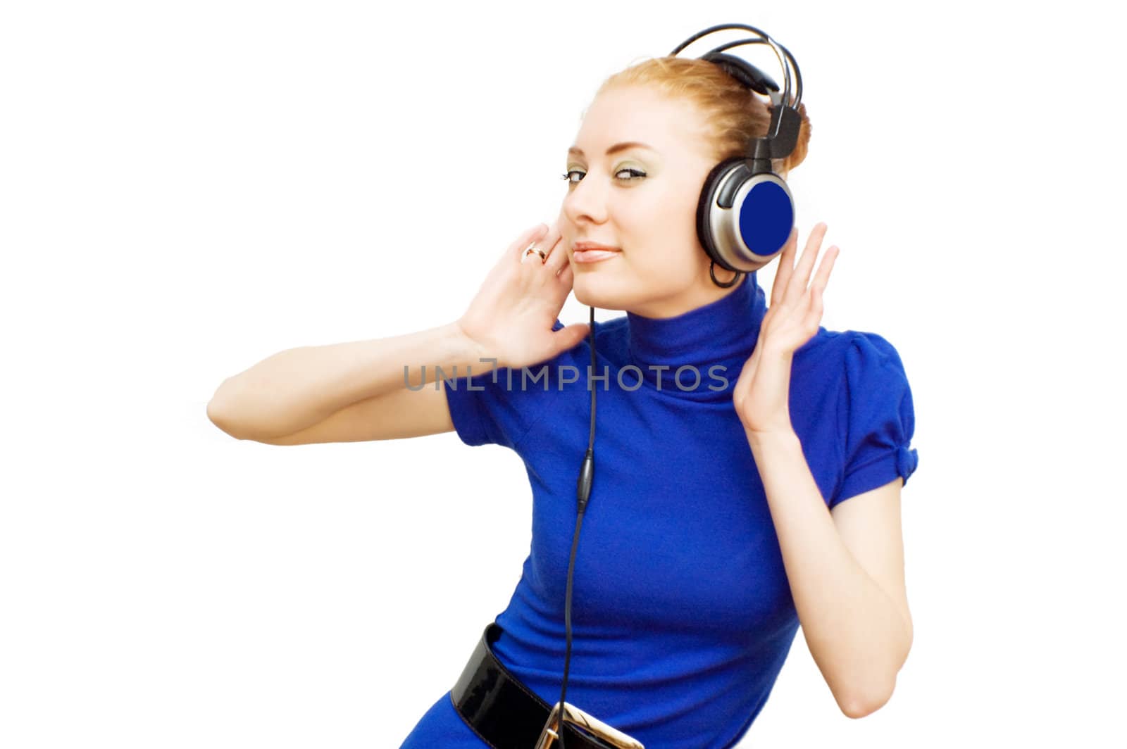 Redhead woman with headphones enjoying music over white