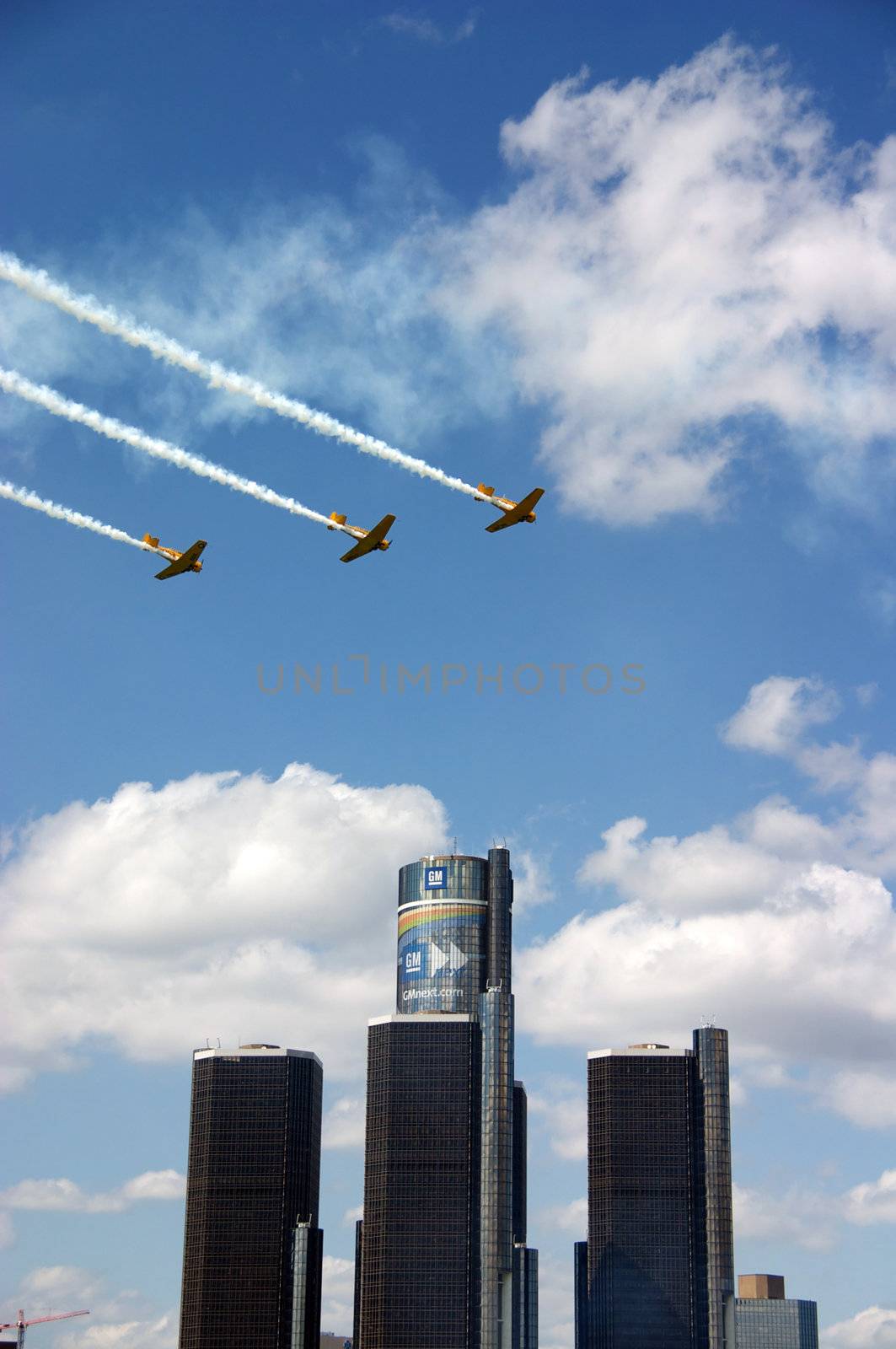 Three planes flying over the Renaissance Center in Detroit, MI durring the Red Bull Air Races.
