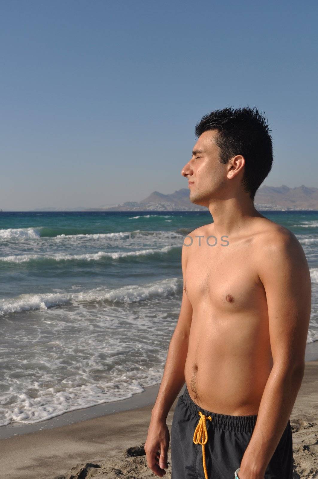 Man at the beach by luissantos84