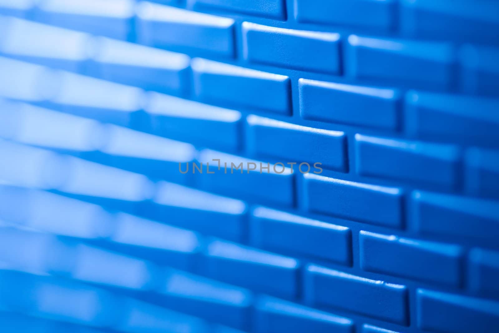 A wall formed by metal bricks