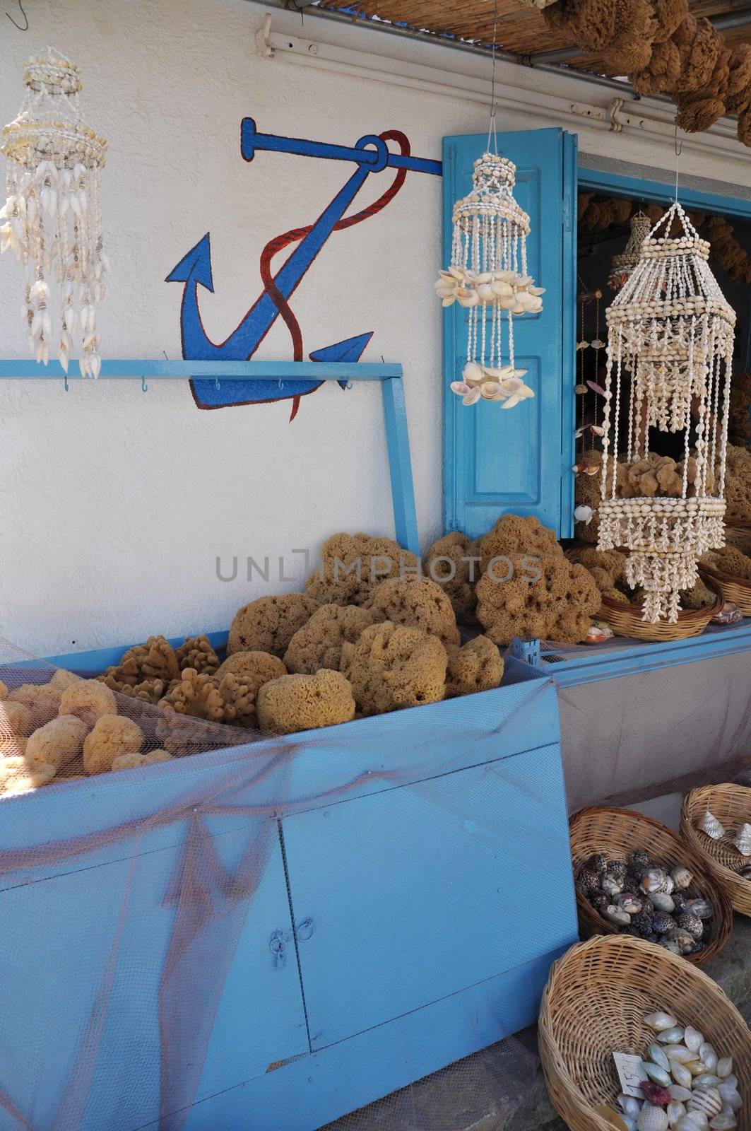 typical souvenir shop with sponges and seashells from the Kalymnos island, Greece