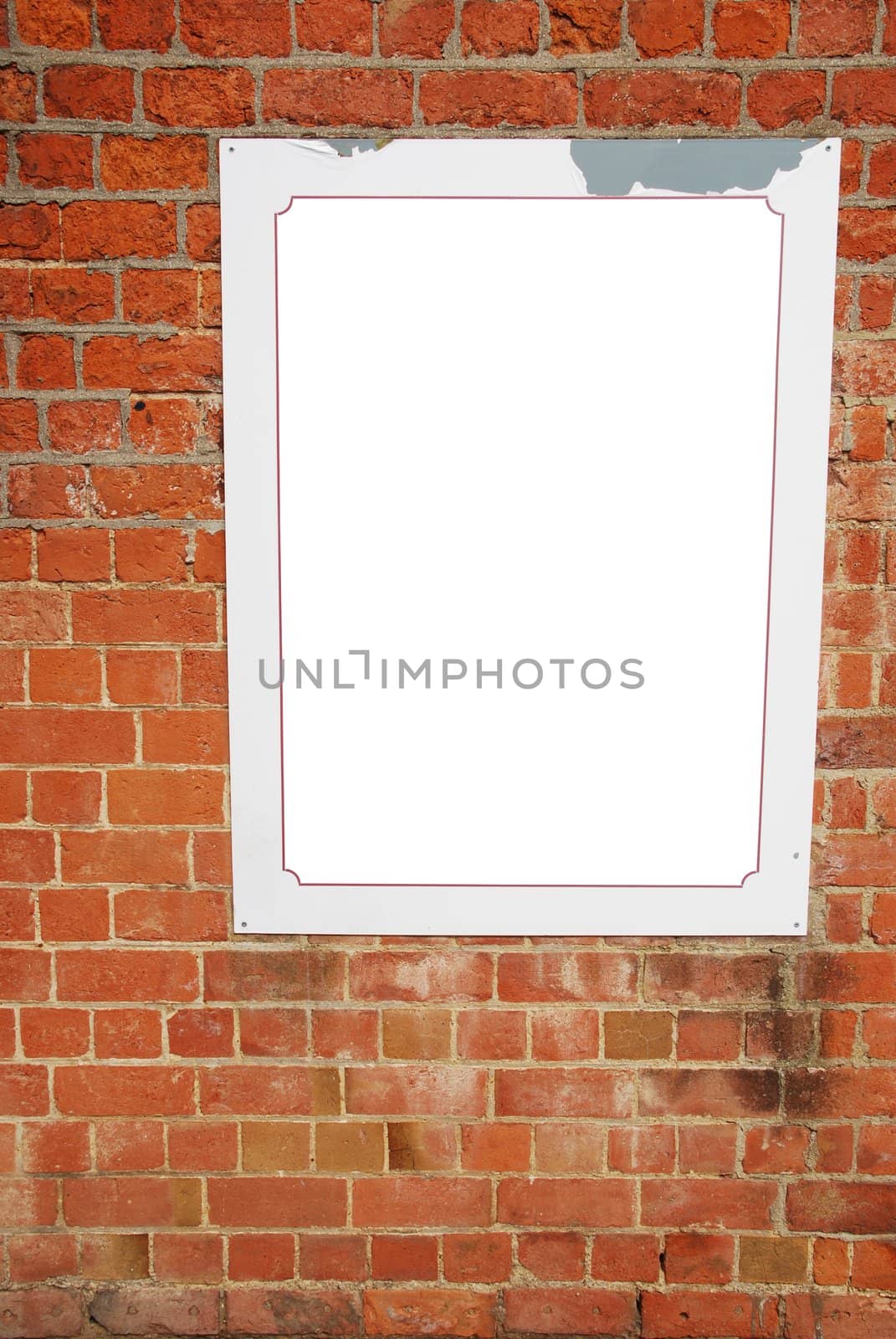 empty billboard on a beautiful brick wall building