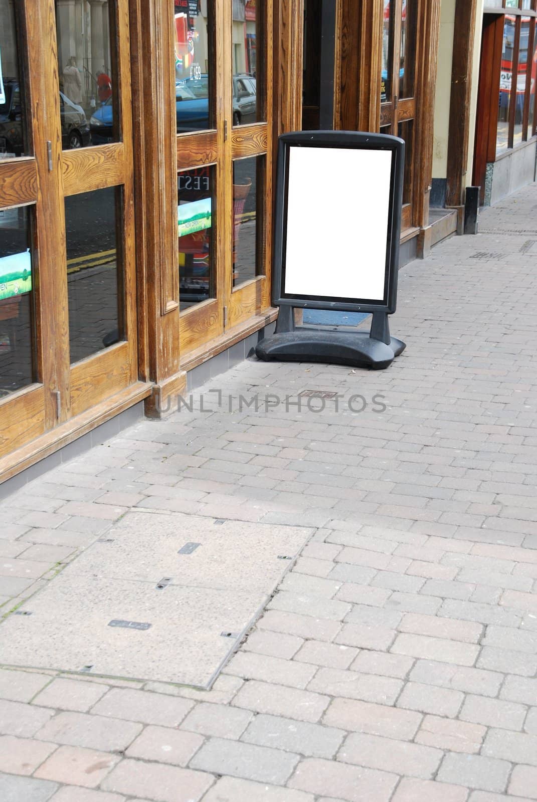 empty outdoor restaurant/pub menu in a british downtown street