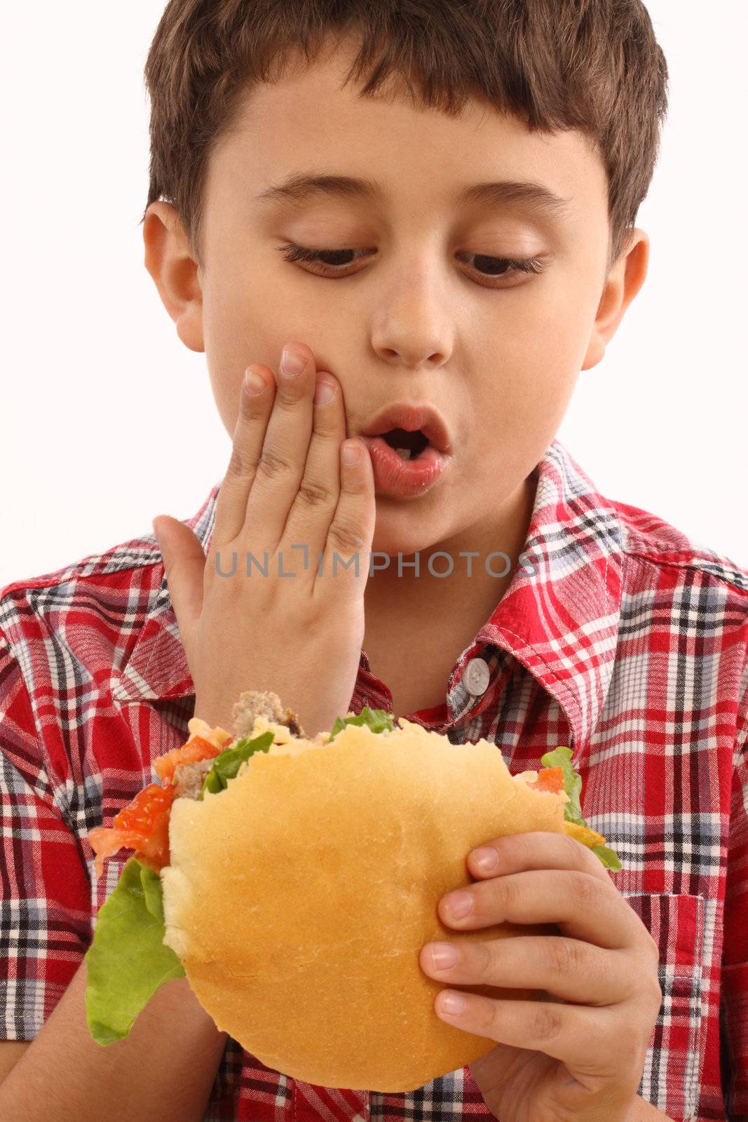 boy eating  hamburger by alexkosev