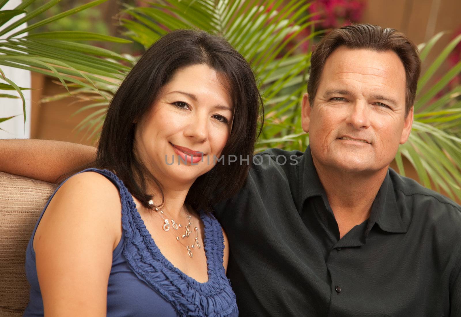 Happy Attractive Hispanic and Caucasian Couple Portrait.