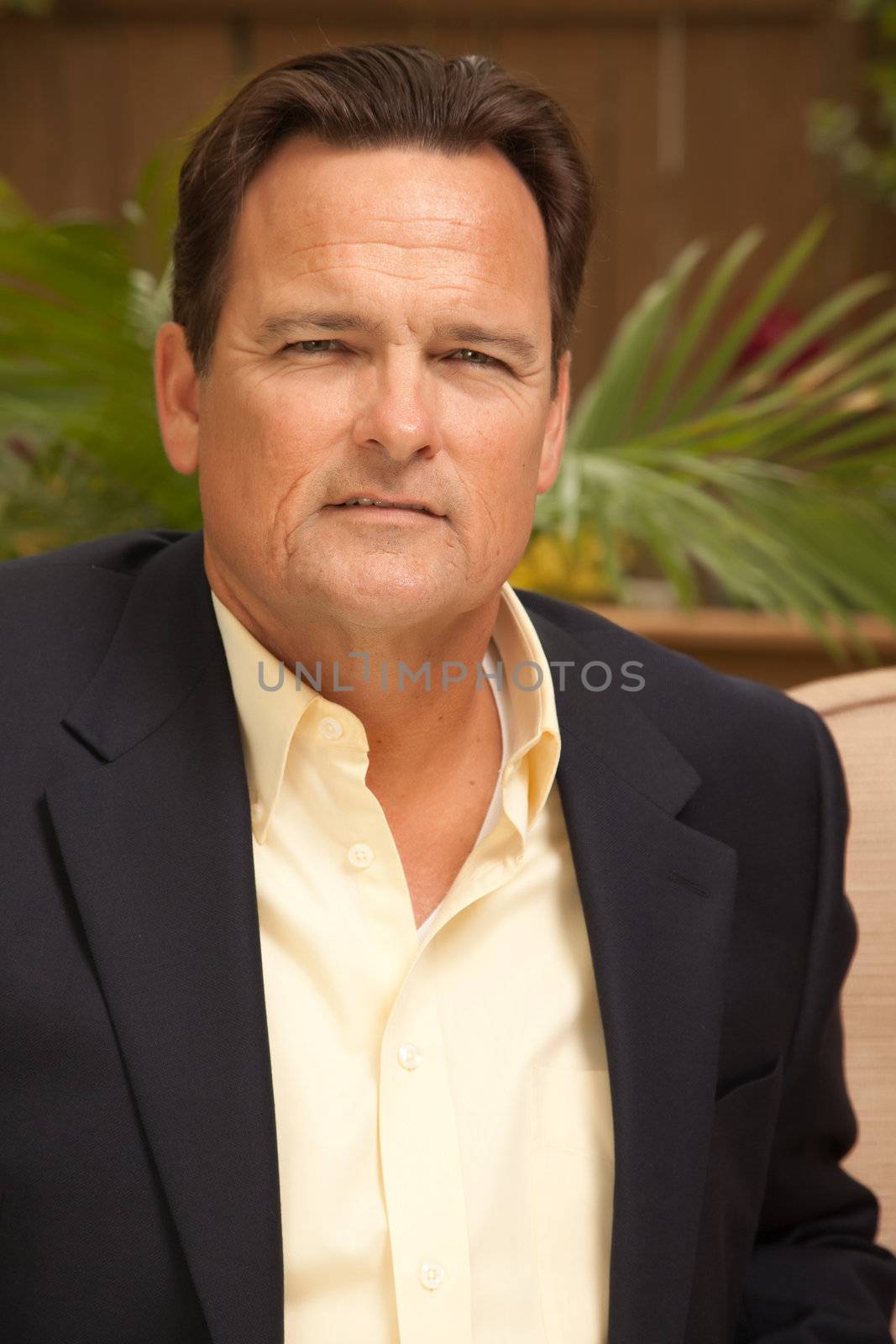 Handsome Male Portrait with Sport Coat in the Outdoors.