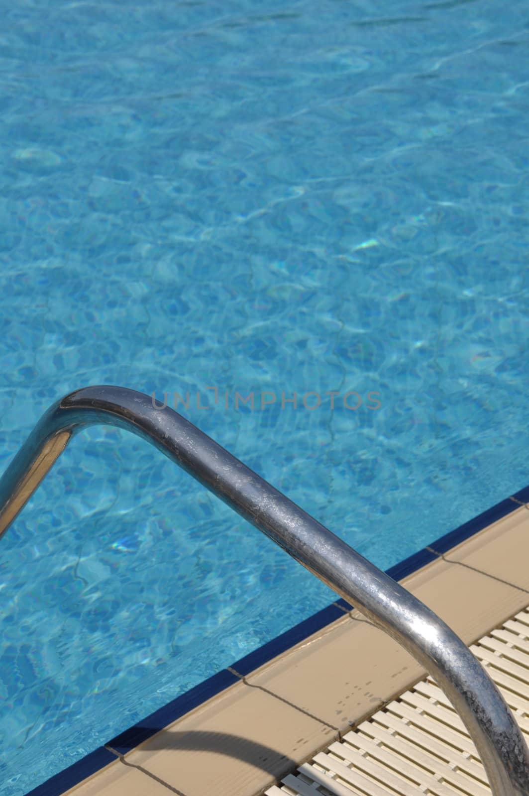 vibrant swimming pool side with ladder