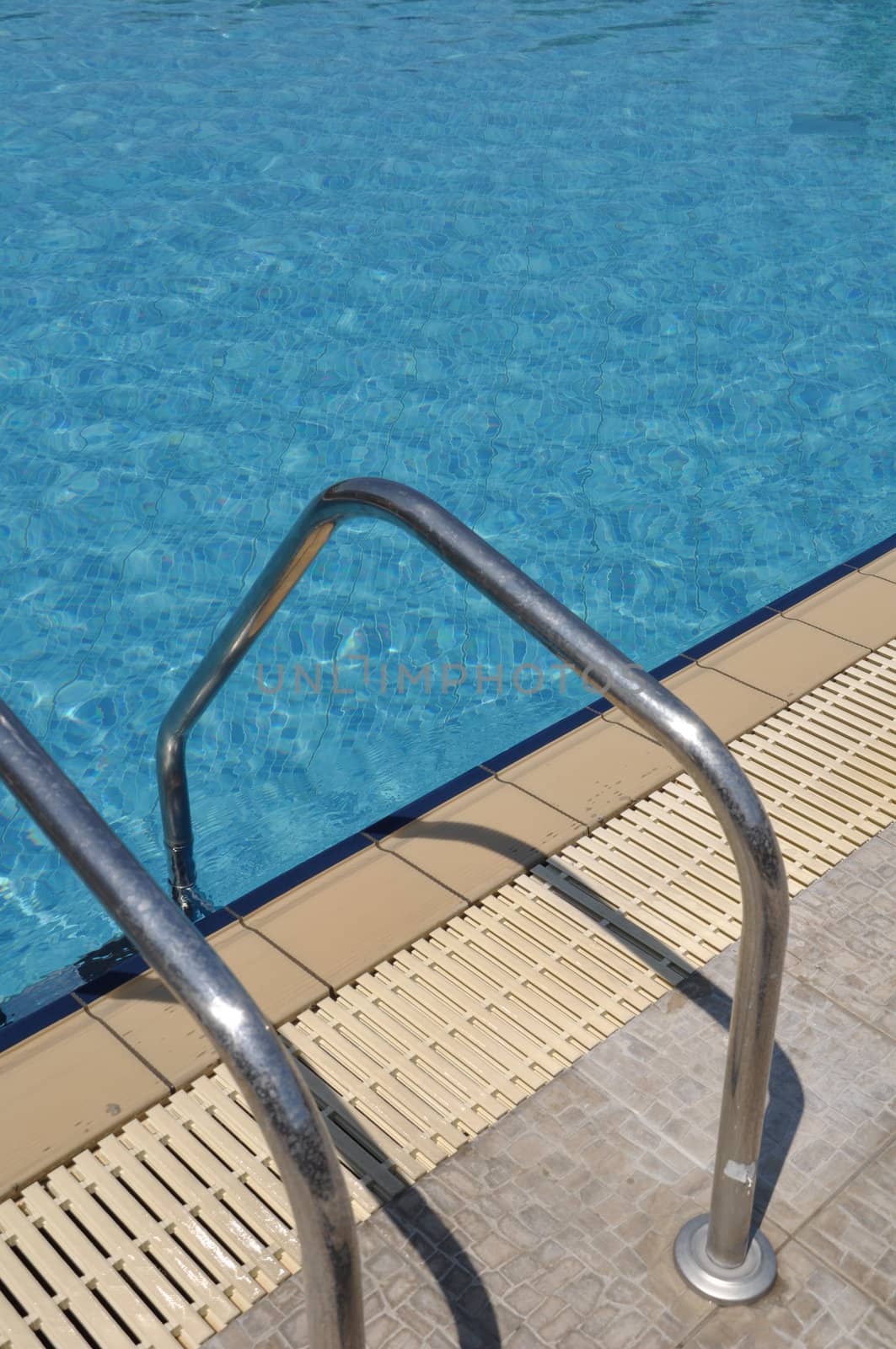 vibrant swimming pool side with ladder