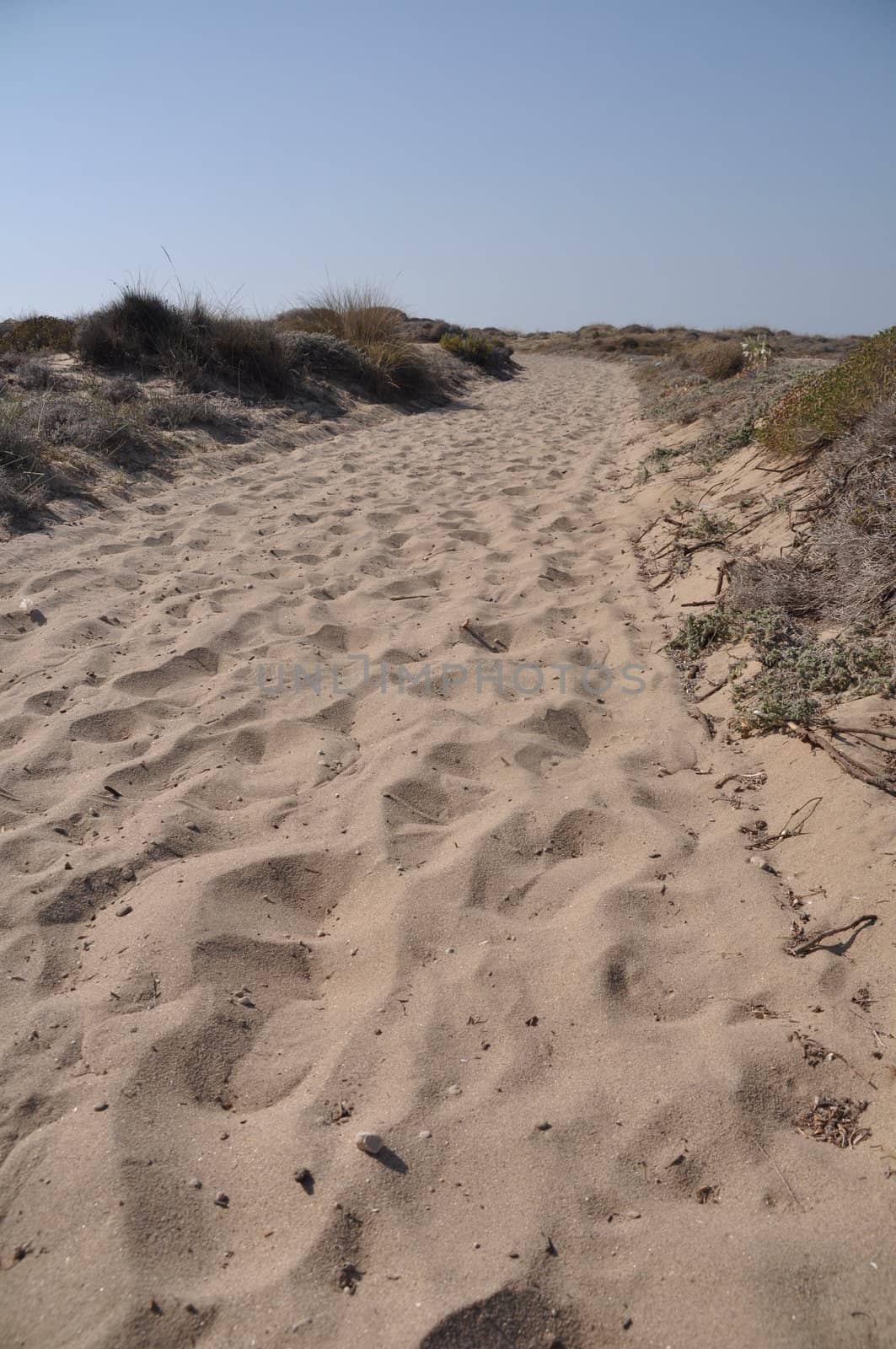 walkway over sand dunes to a beach in Kos island, Greece