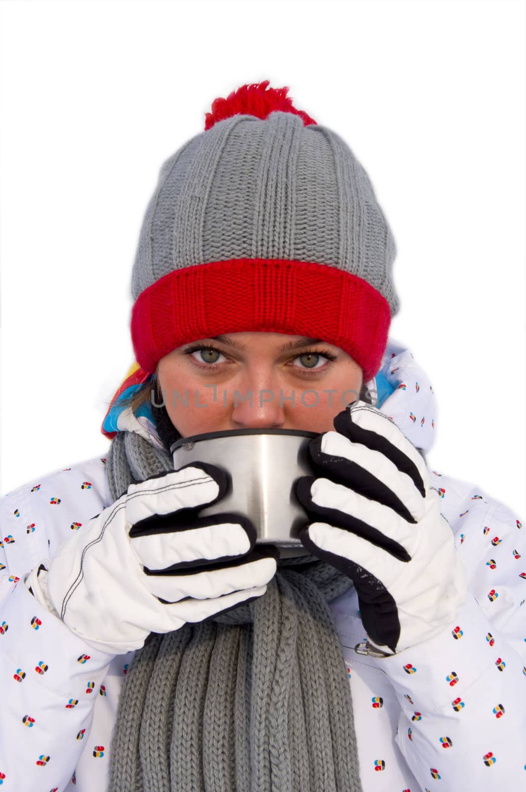 Attractive woman drinking hot tea from a mug. On a white background. Close-up.