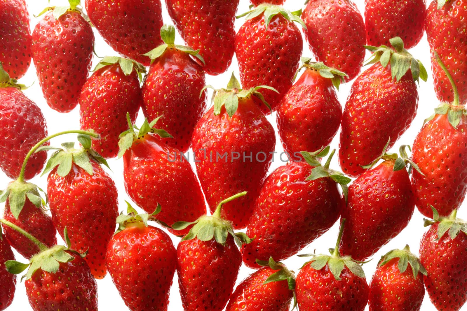 Pattern of red ripe strawberries on white background