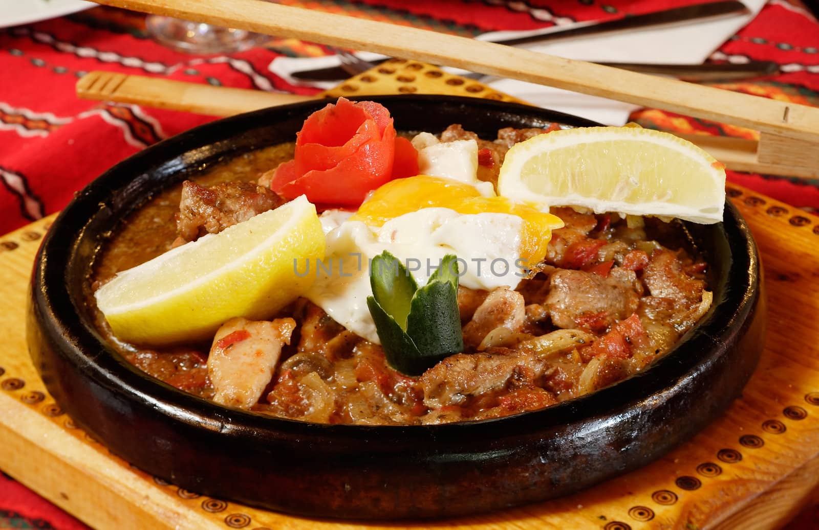 Bulgarian tasty food on pottery sach dish