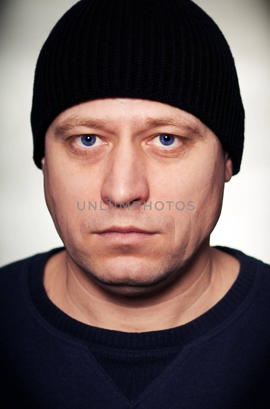 portrait of a man in a black knitted hat