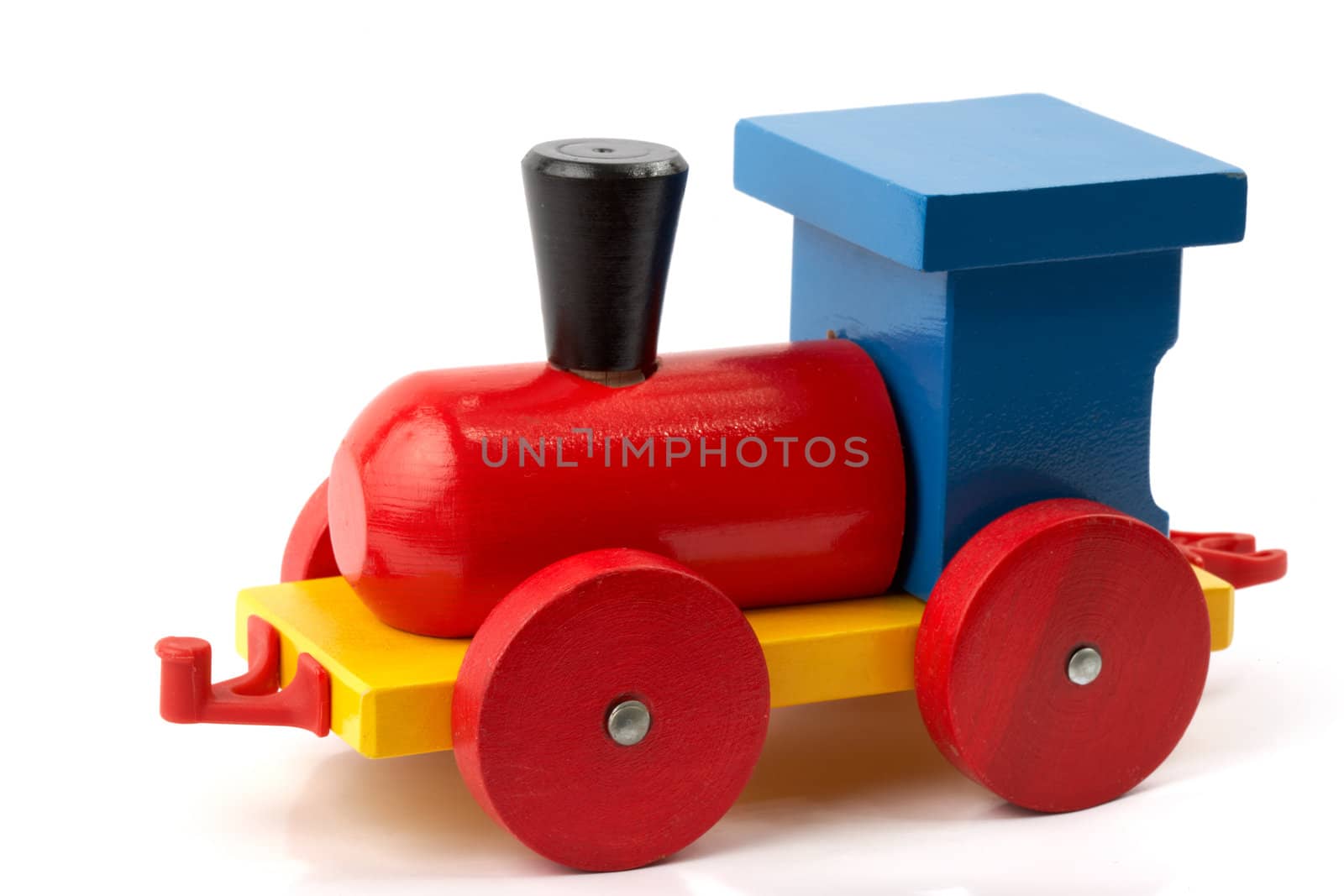 Wooden toy, a locomotive in red and blue, isolated on white