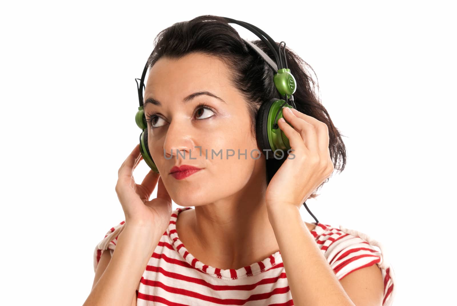 Young woman listening music with headphones isolated on white background by dgmata