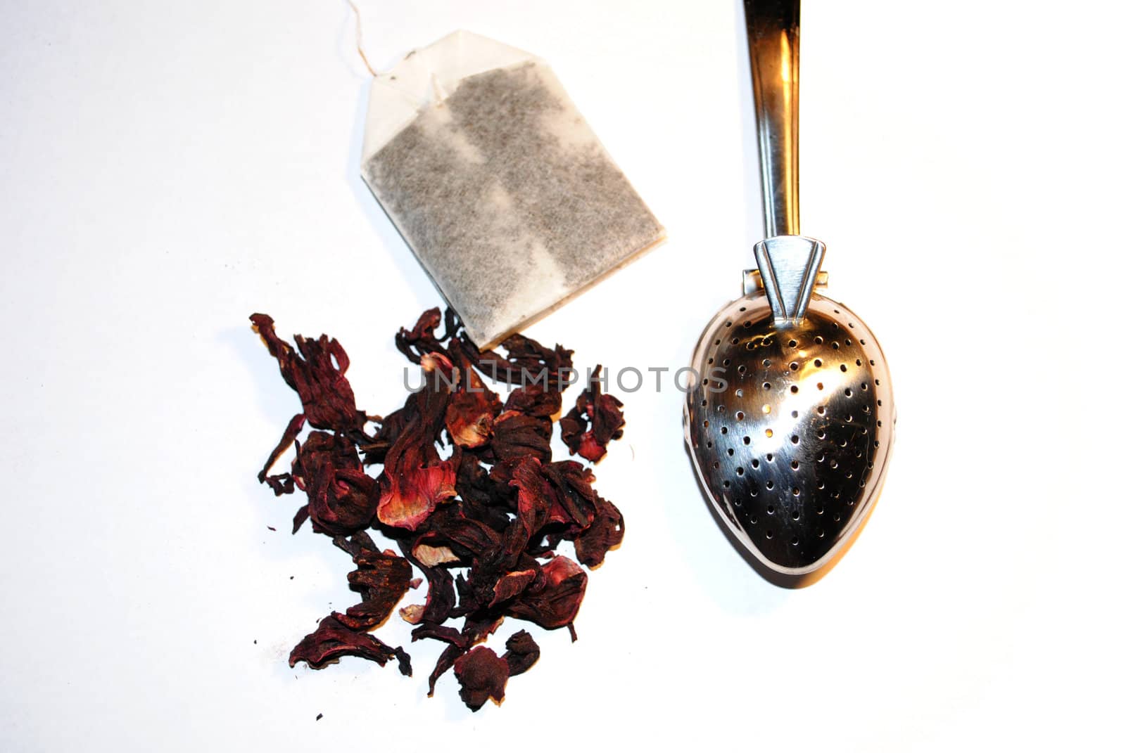Tea leaves, tea bag and tea utensil.