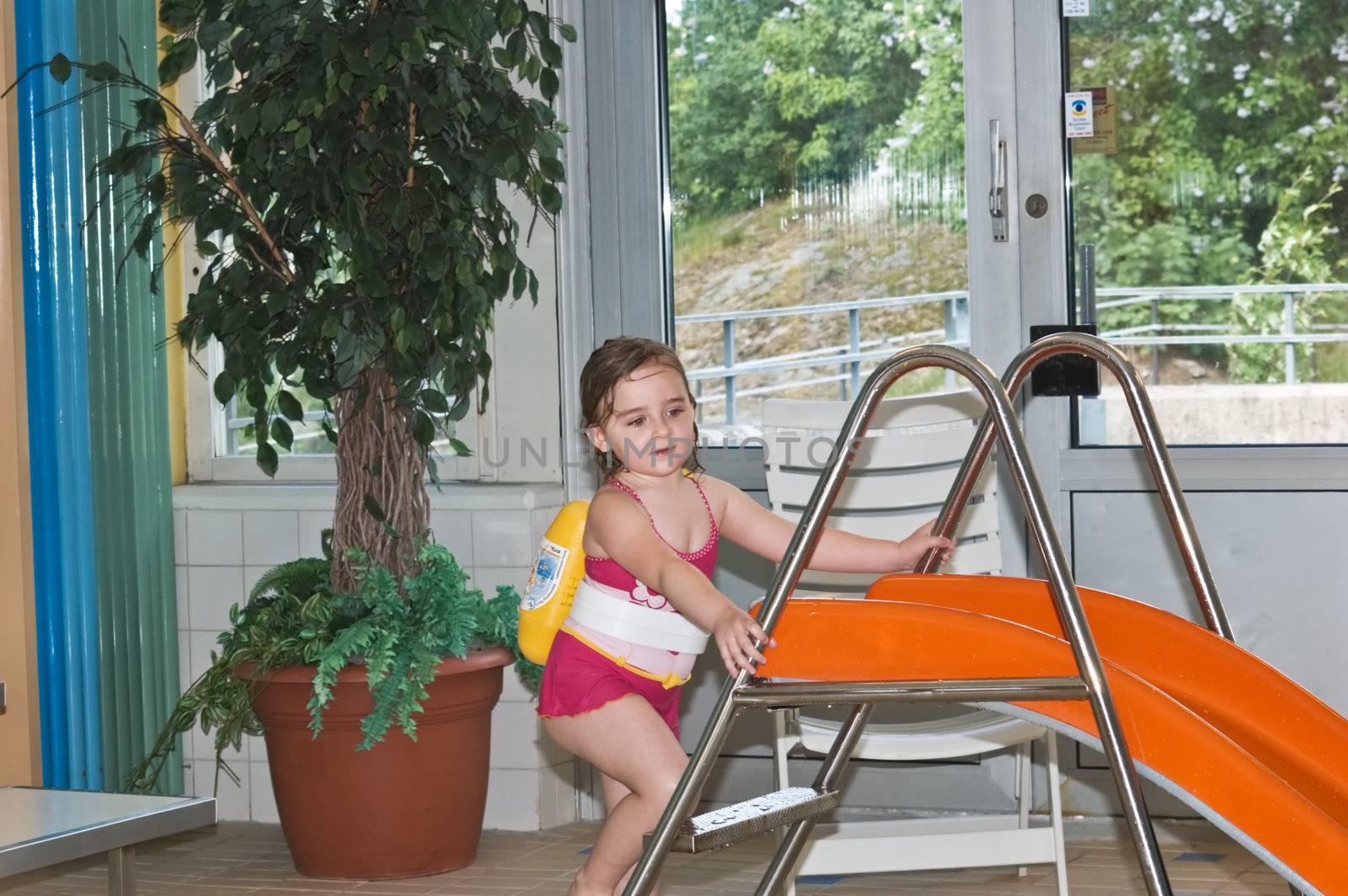 4 years old girl in swimming pool