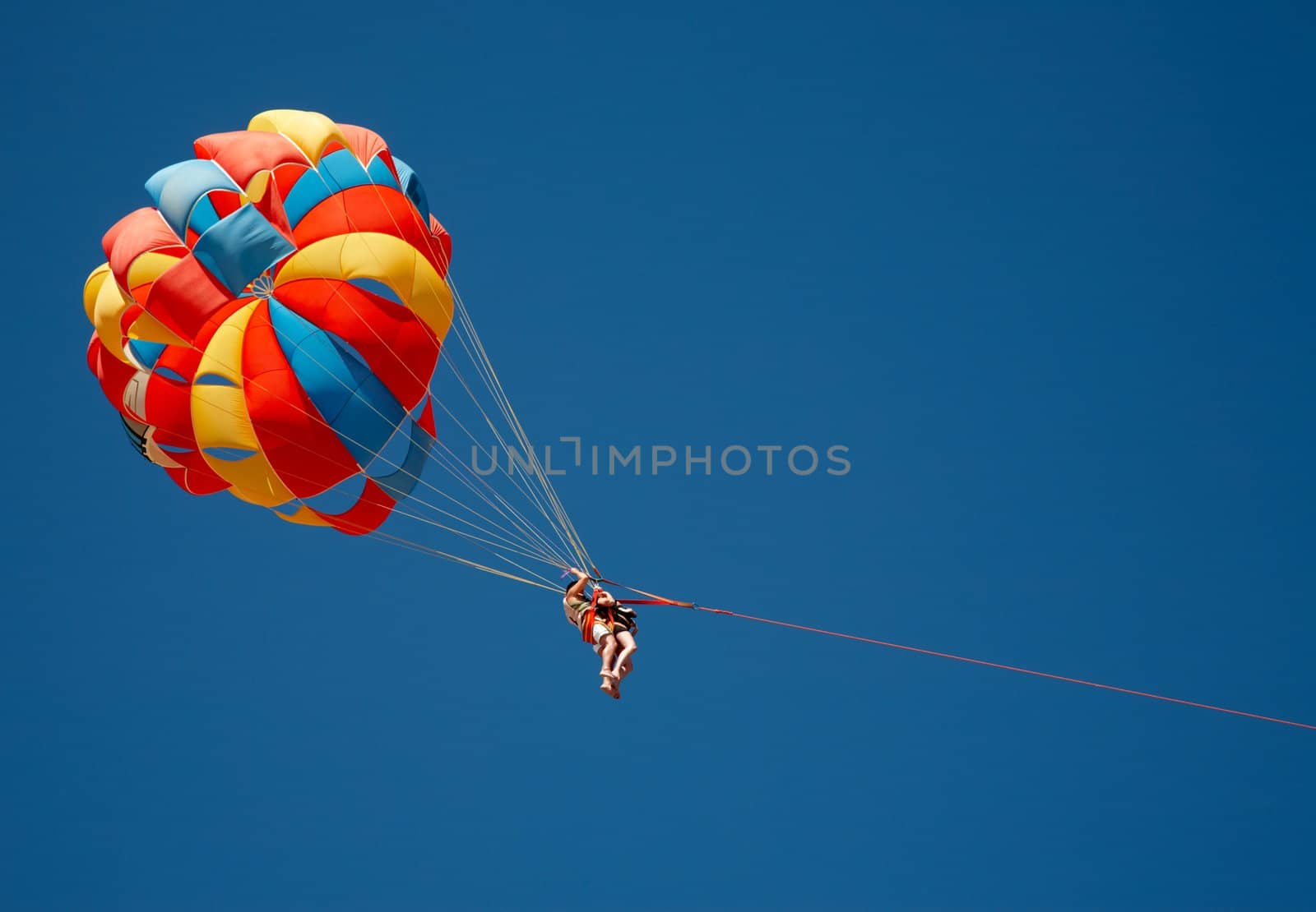 Colorful parachute in the blue sky