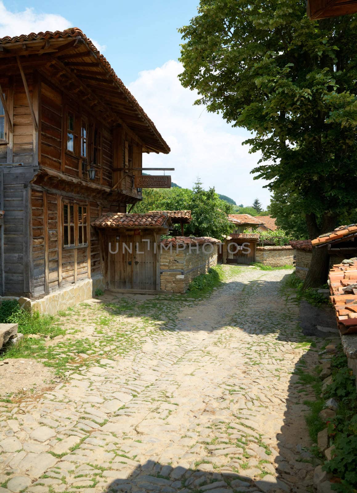 Street with wooden houses in Jeravna village, Bulgaria