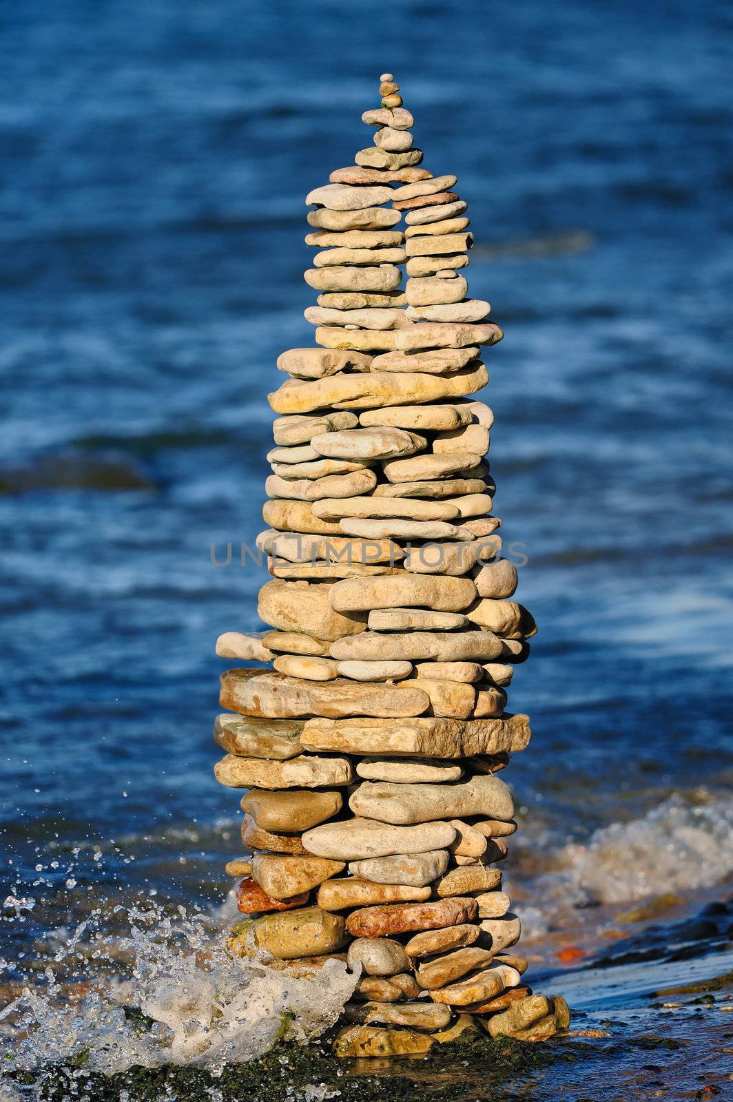 Stout pile of boulders on the sea shore