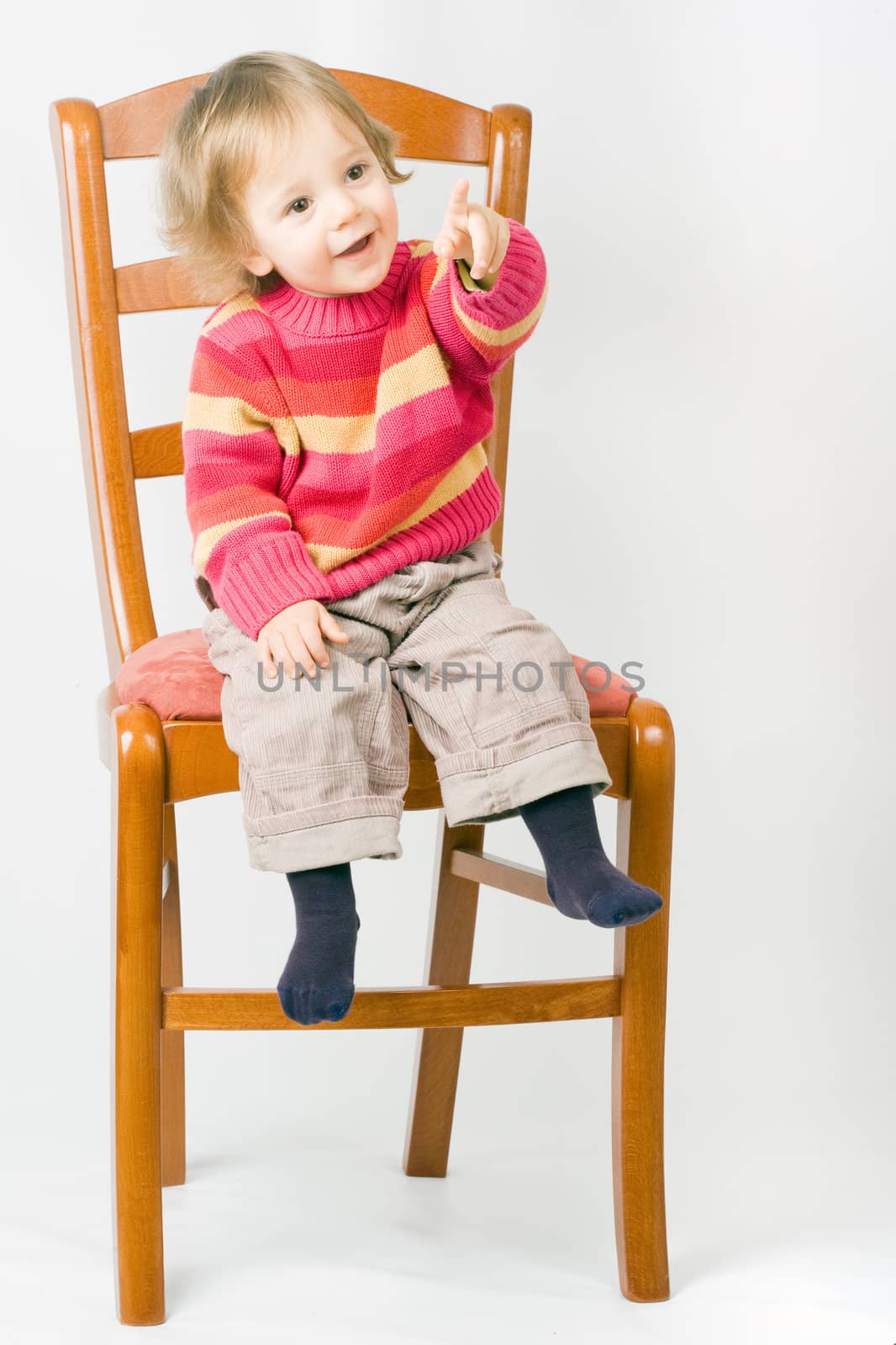 One year old child sitting on a chair