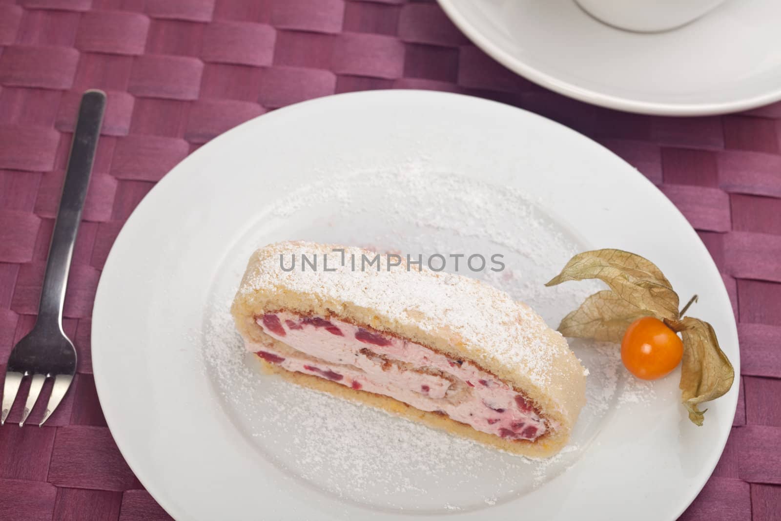 slice of a jelly roll cake on a white plate by bernjuer