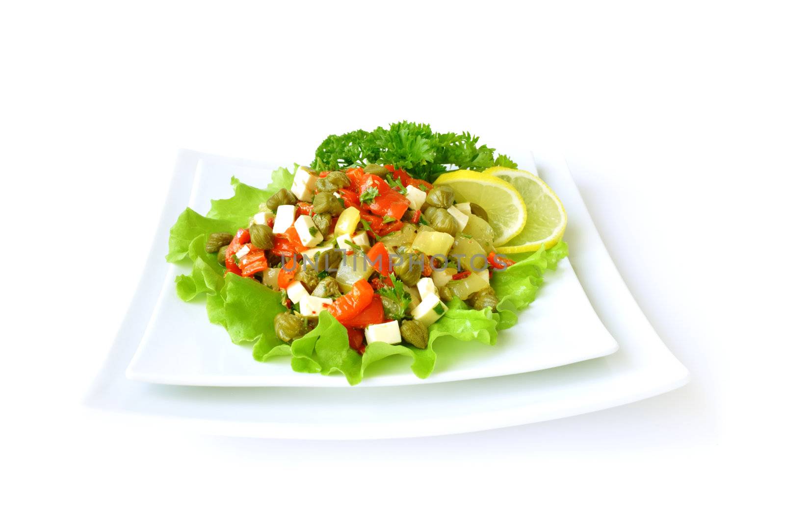 A salad of red peppers with goat cheese, capers, fresh herbs in the marinade