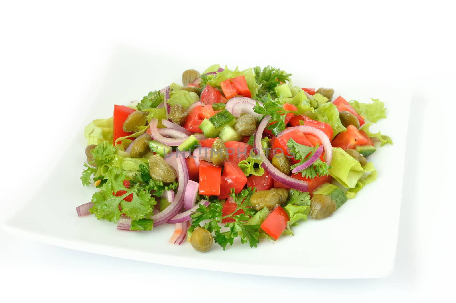 Vegetable salad with capers and herbs close	