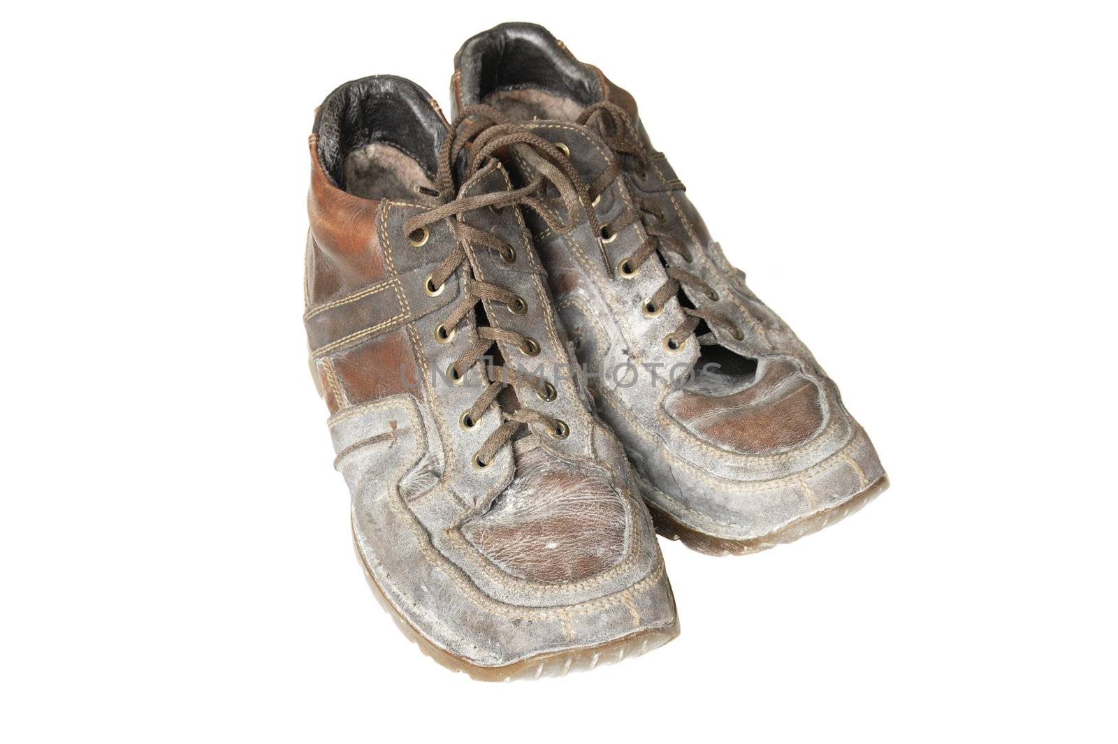 dirty boots in the construction dust on a white background