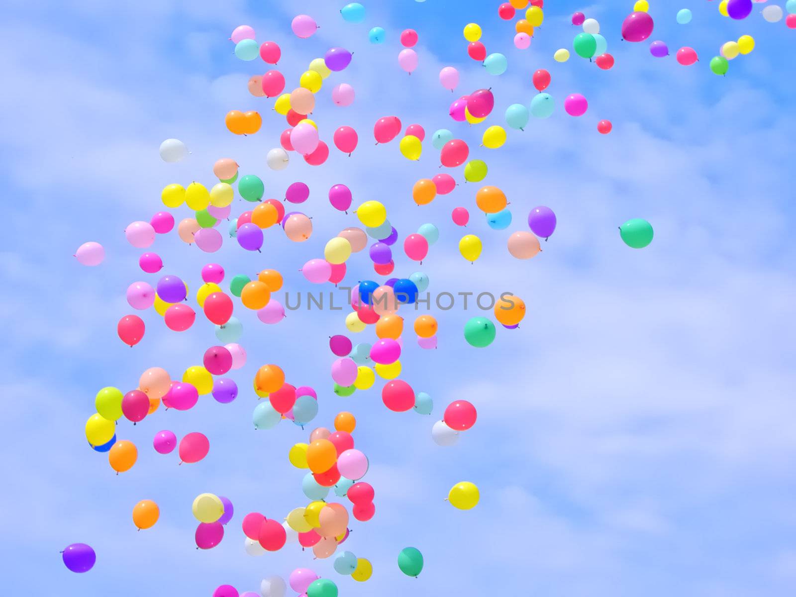 A lot of colorful balloons flying in the sky