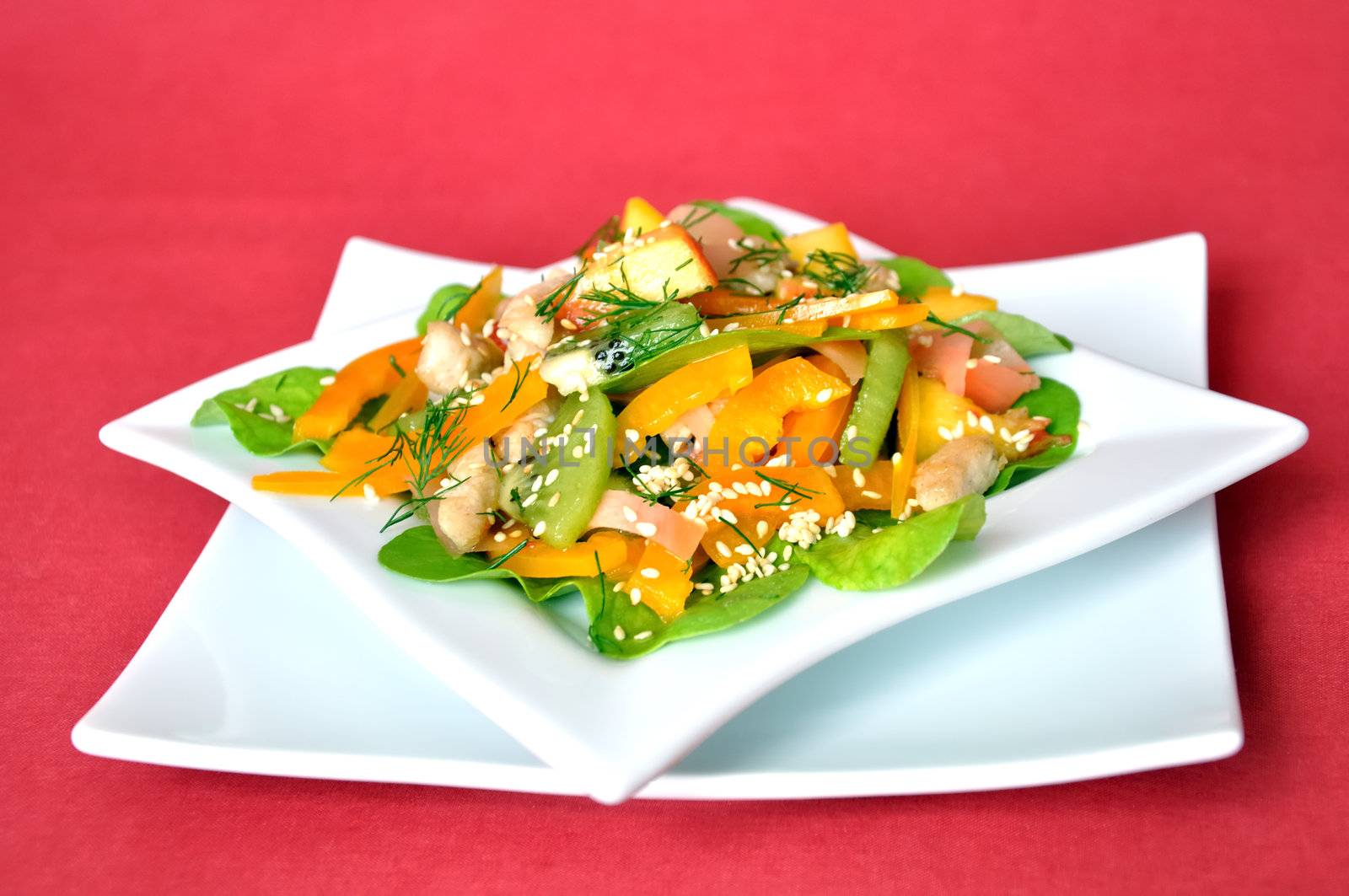 salad vegetables and fruit with chicken and arugula