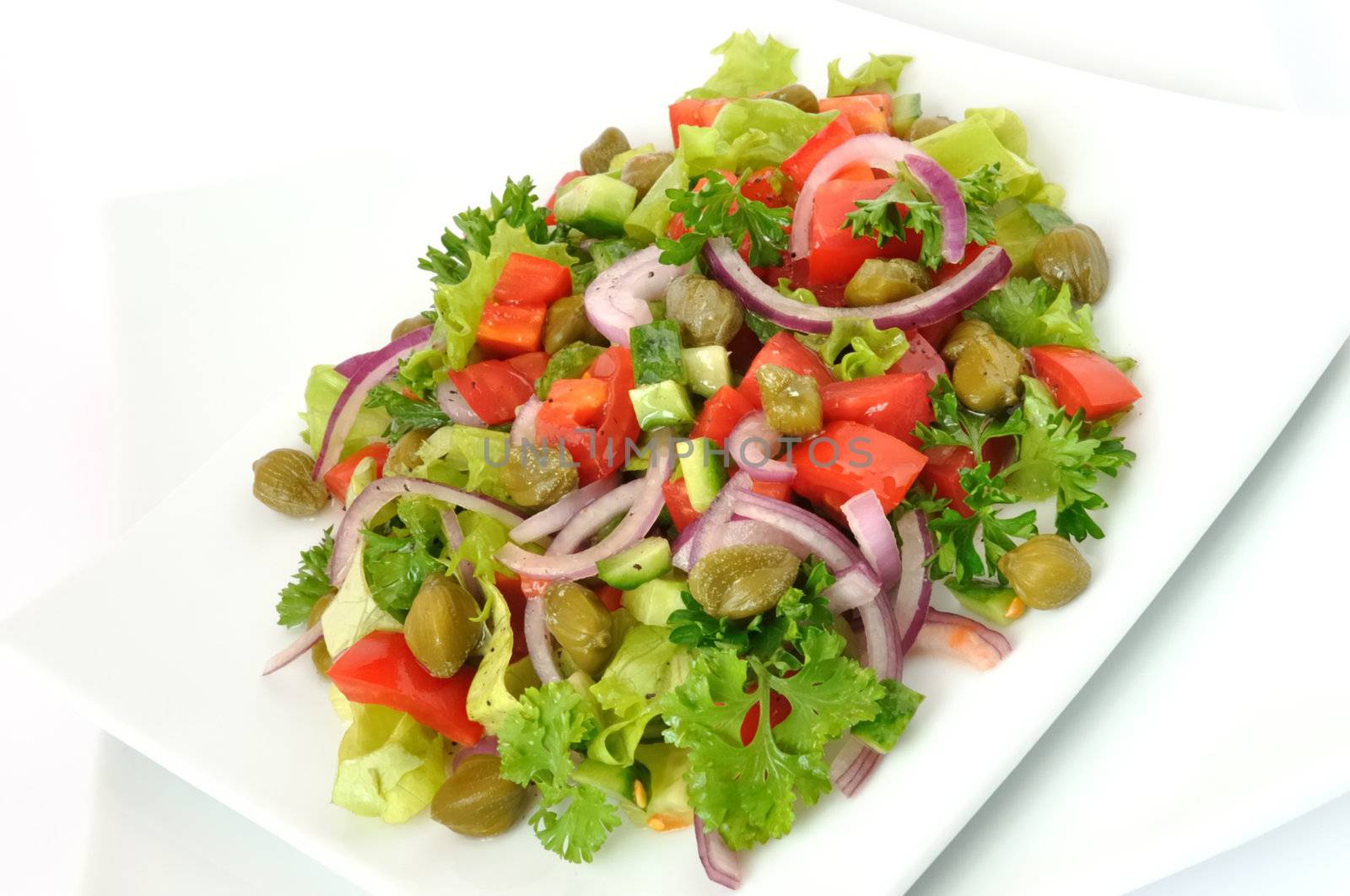 Vegetable salad with capers and herbs close	