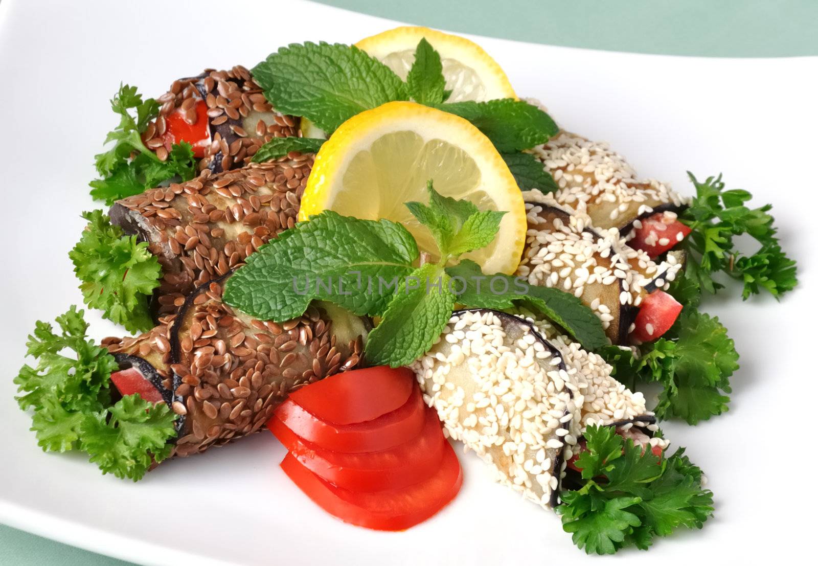 Rolled eggplant with tomatoes in sesame and flax seed