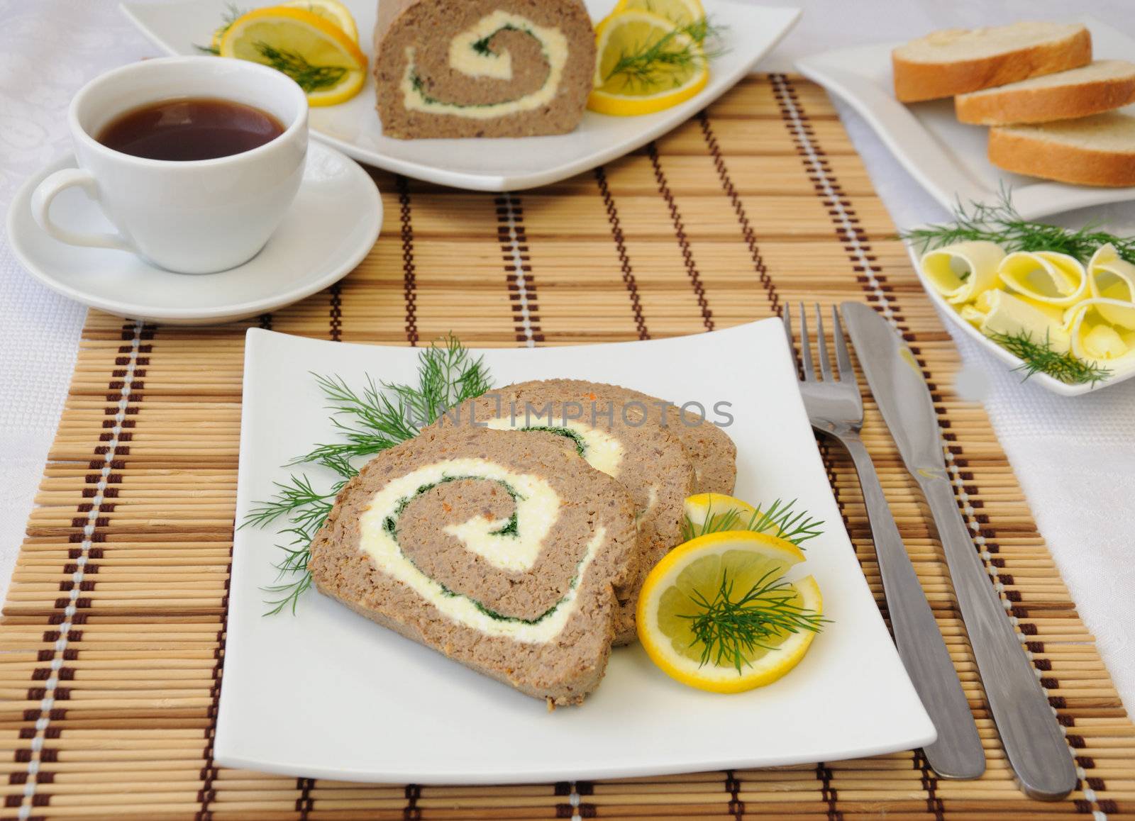 Slices of liver pate with butter and coffee for breakfast

