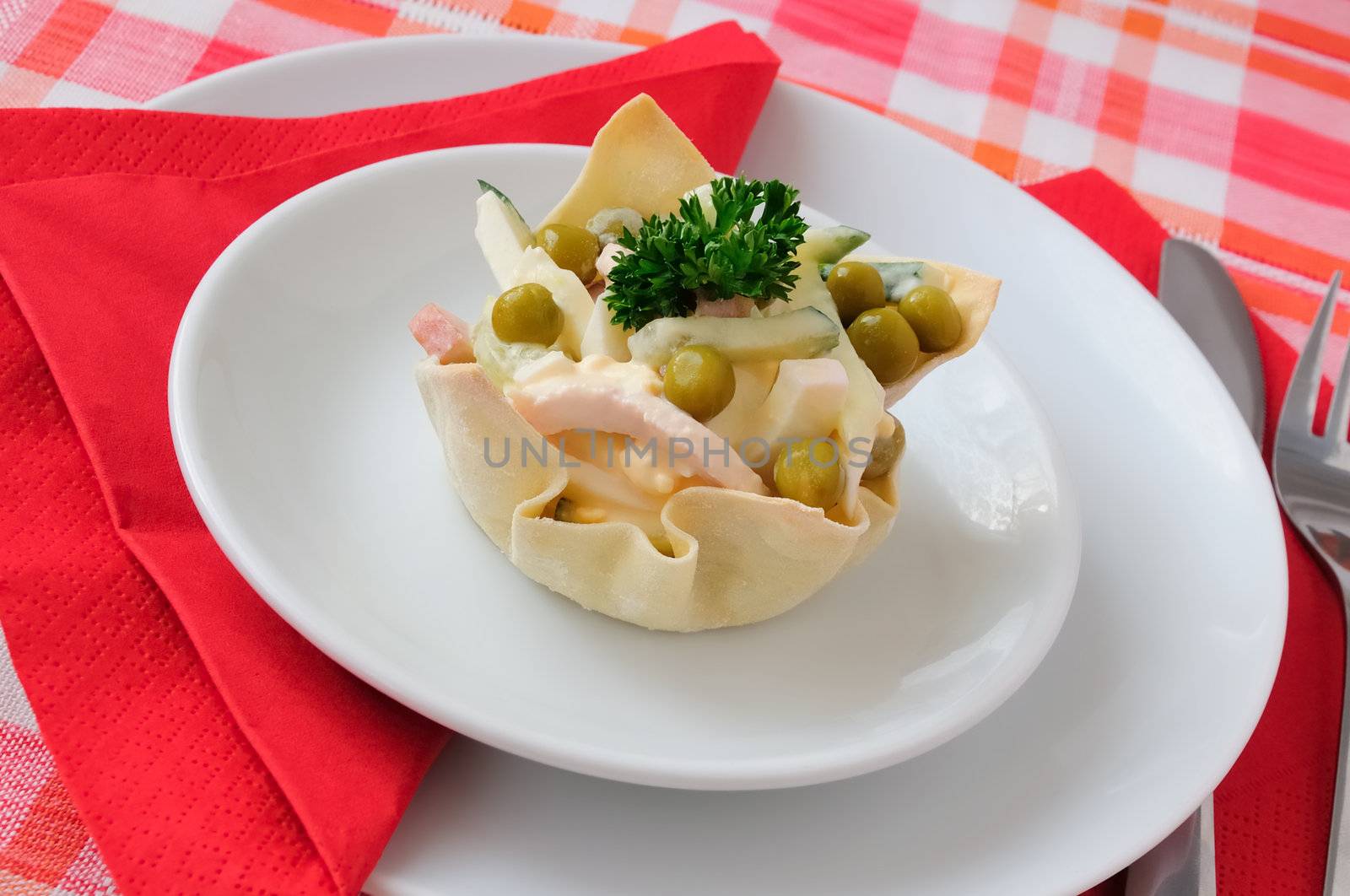 Cucumber salad, eggs, ham, peas, mayonnaise into tartlet (basket)