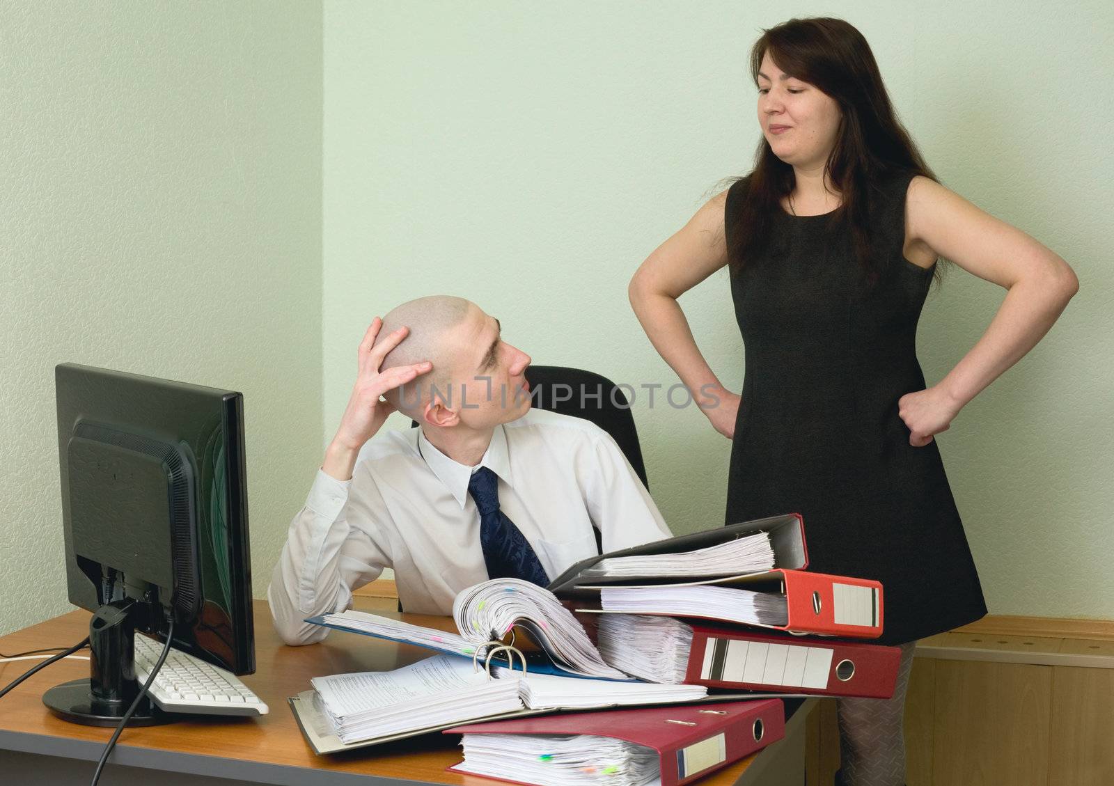 The boss and the secretary on a workplace at office