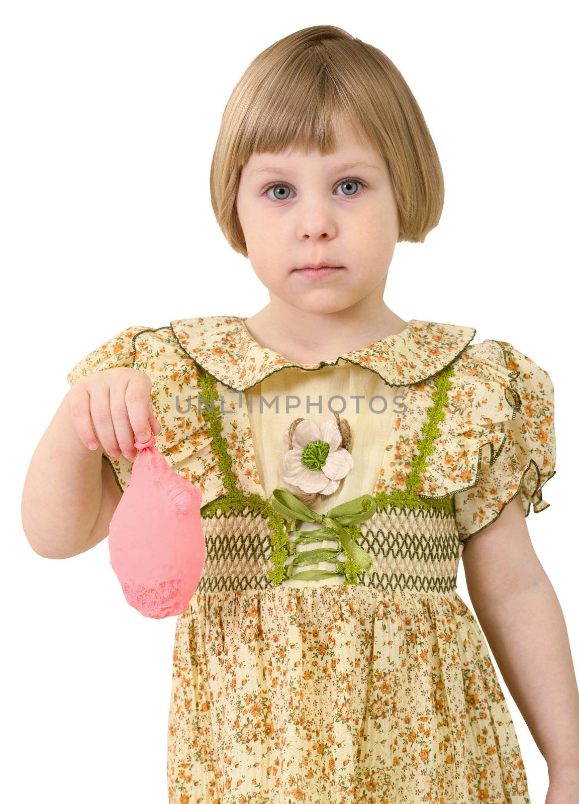 Sad very little girl with blow off pink balloon