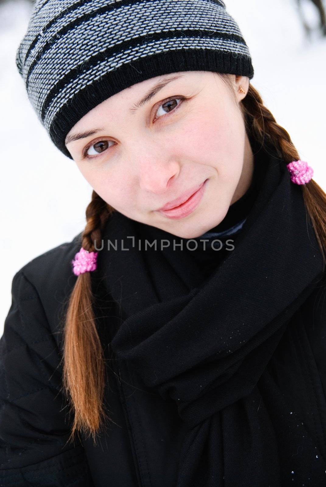 portrait of lovely young woman in winter clothes