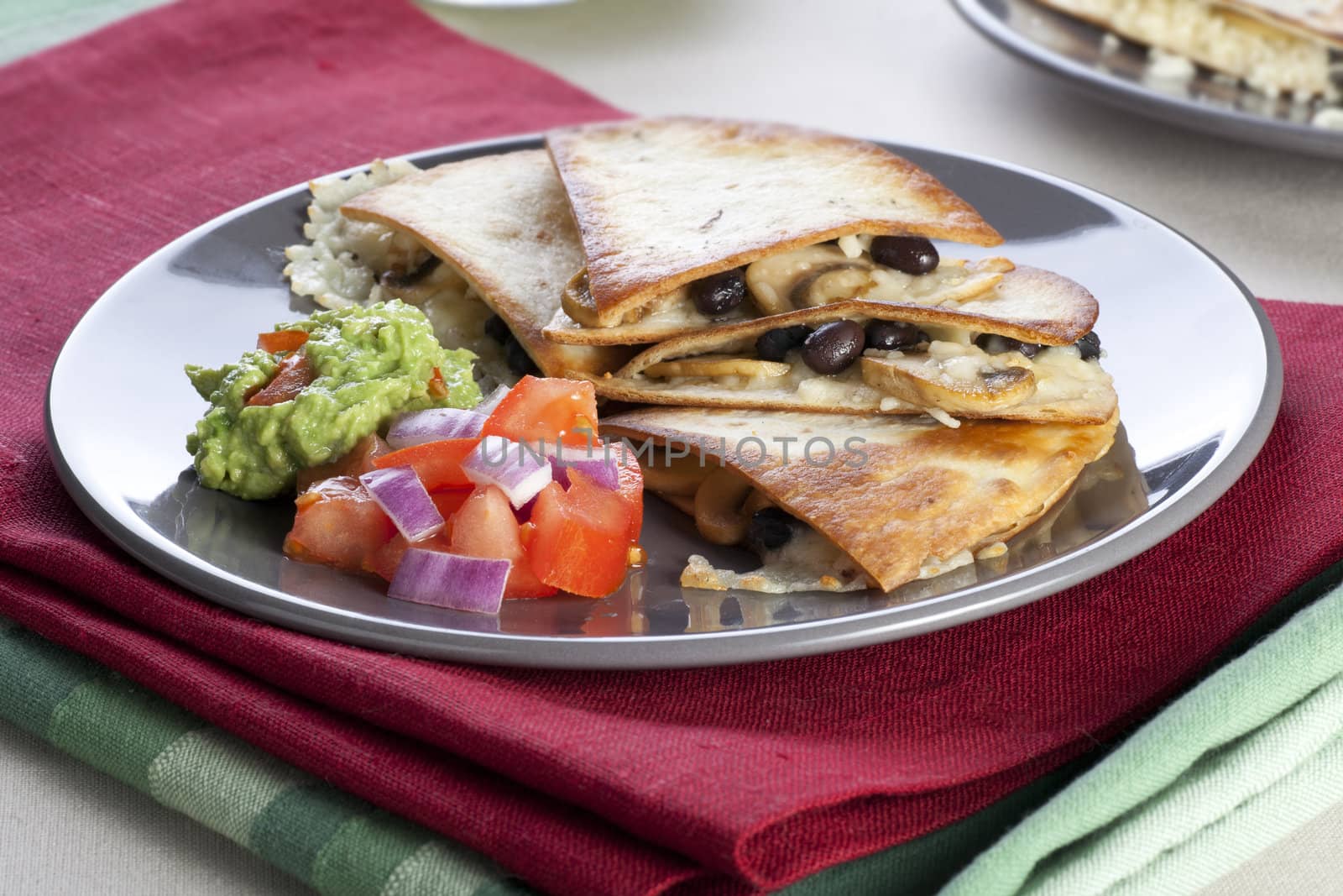 Black bean, mushroom and cheese quesadillas with salsa and guacamole.