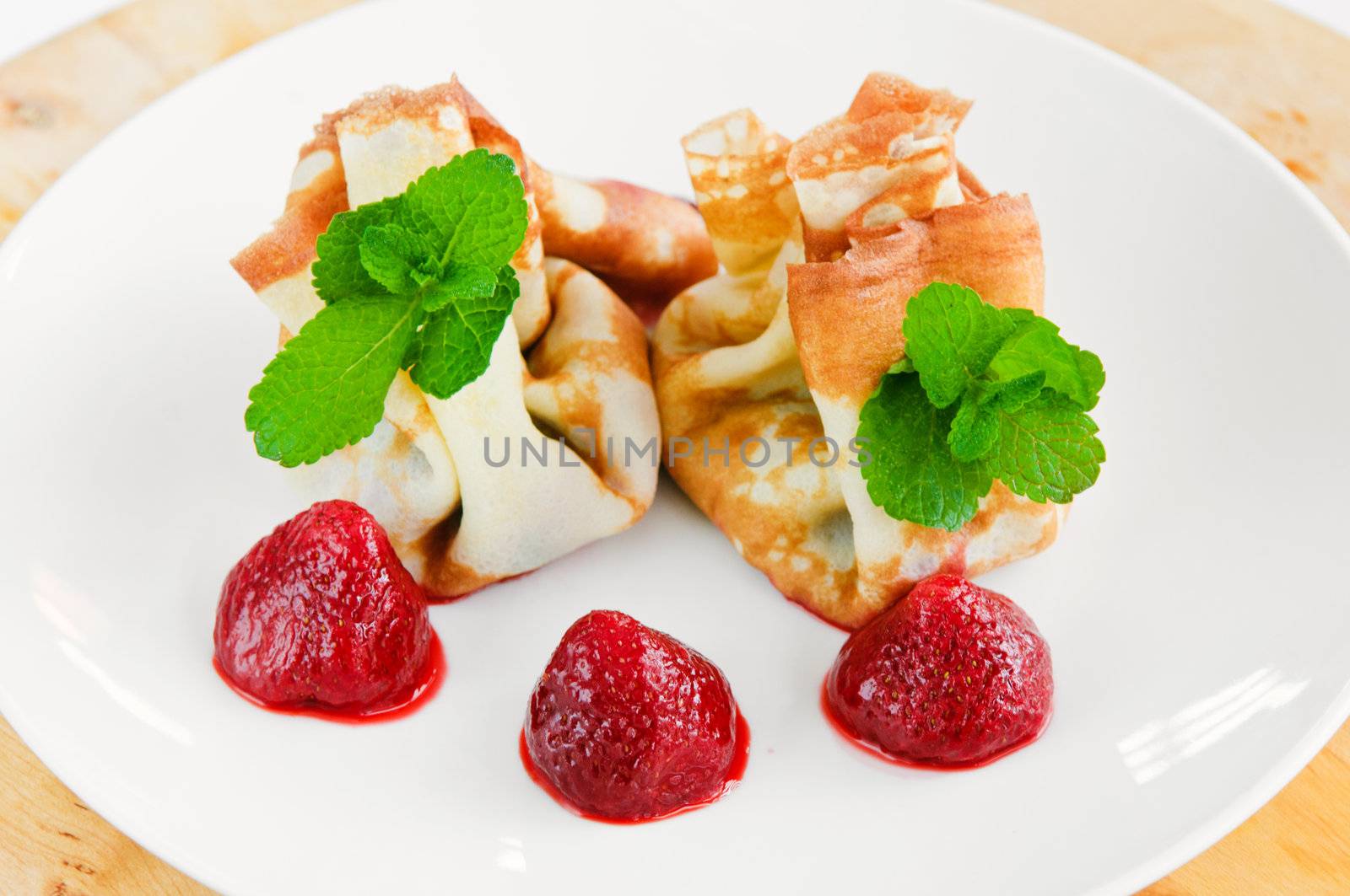 Pancake with curd cheese and fresh strawberries