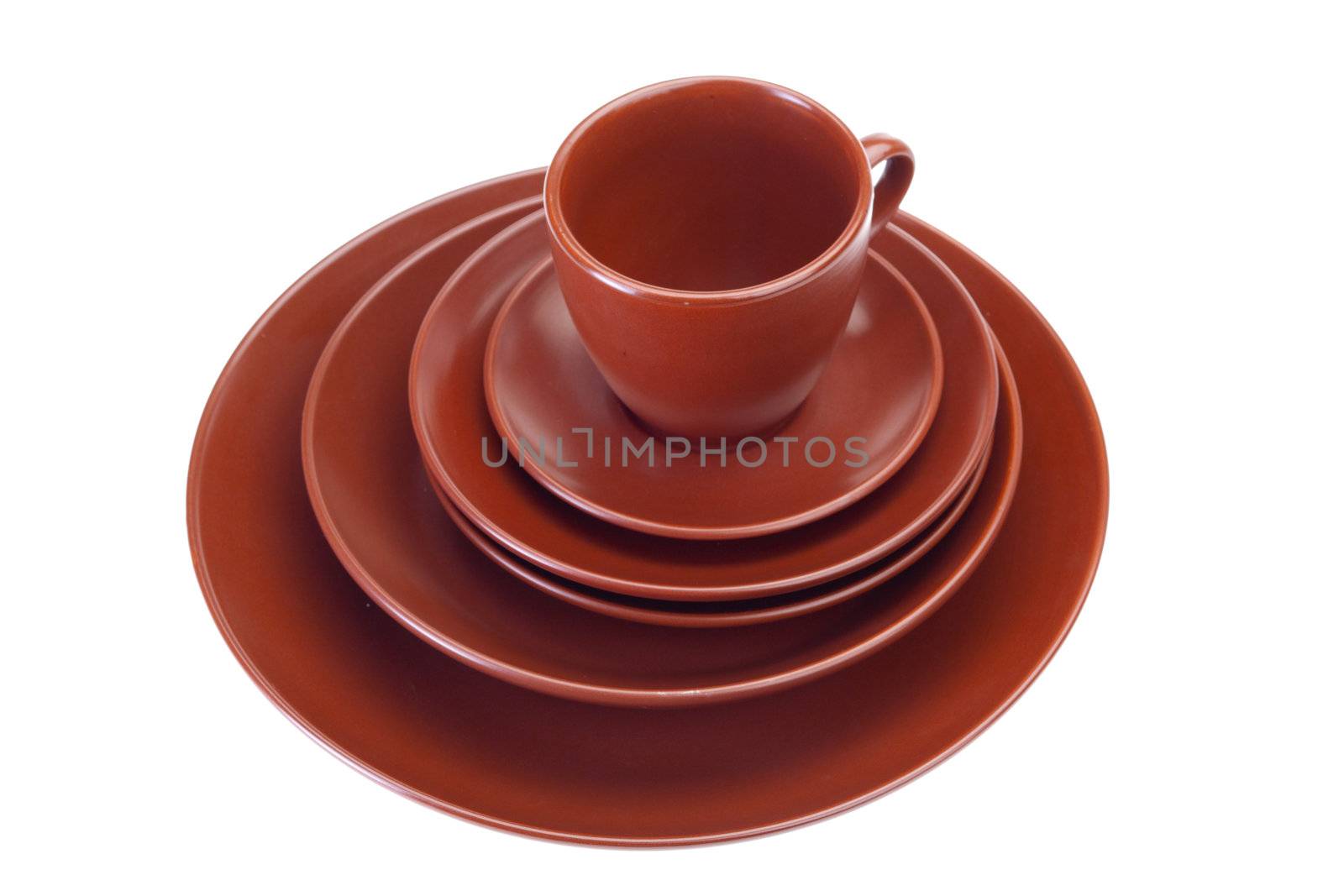 set of tableware over white background, cup and plates