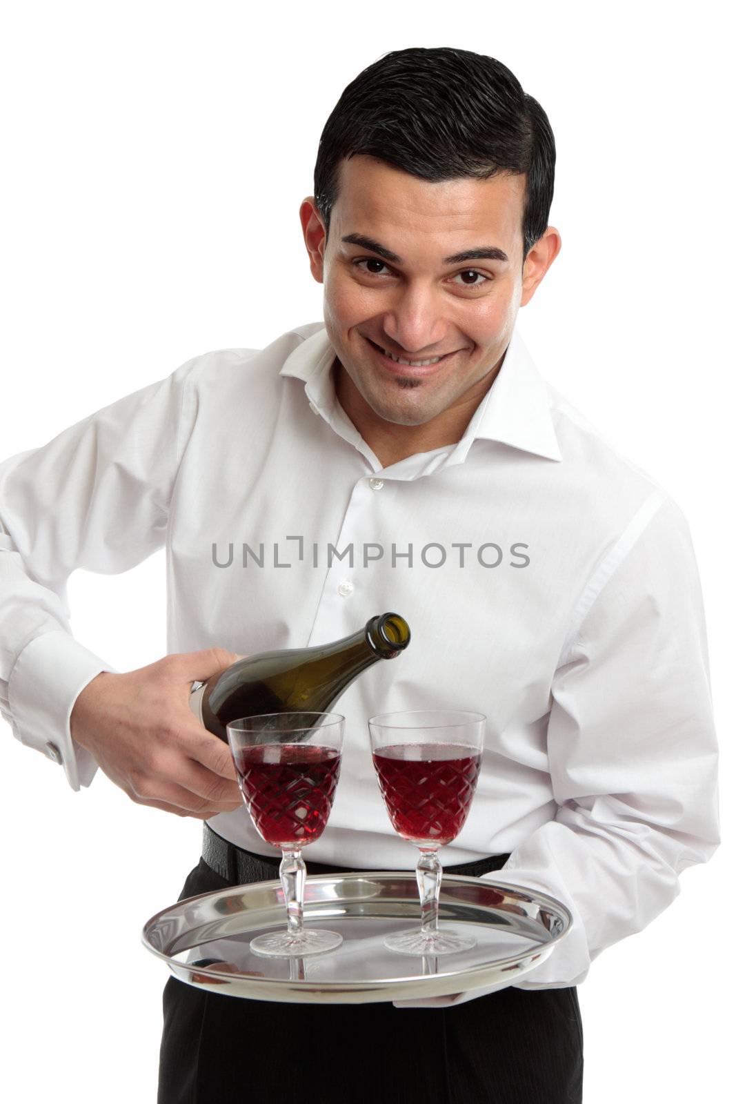 A friendly hospitality smile as a waiter or servant pours wine.  