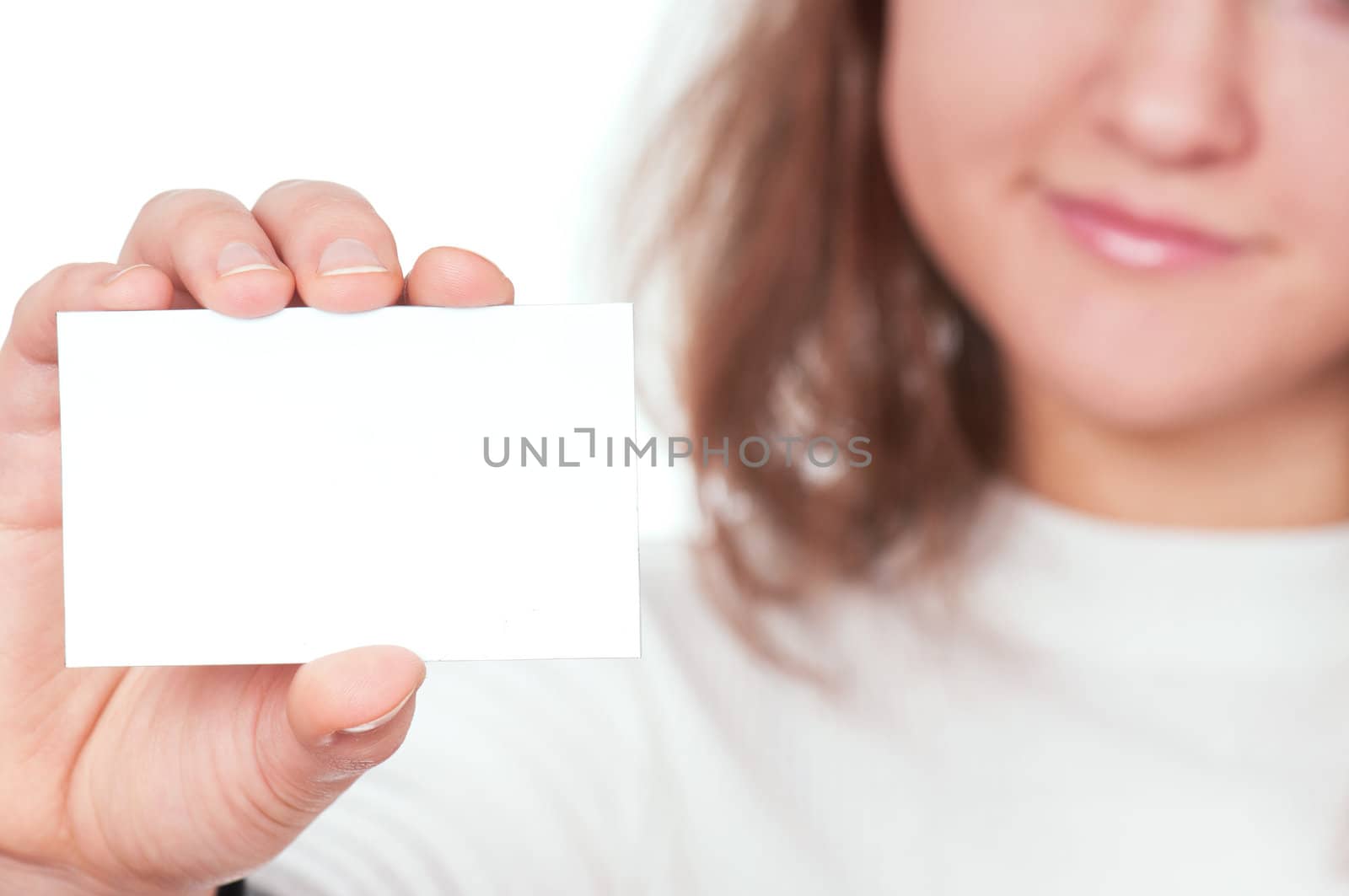 Young beautiful businesswoman holding empty white board